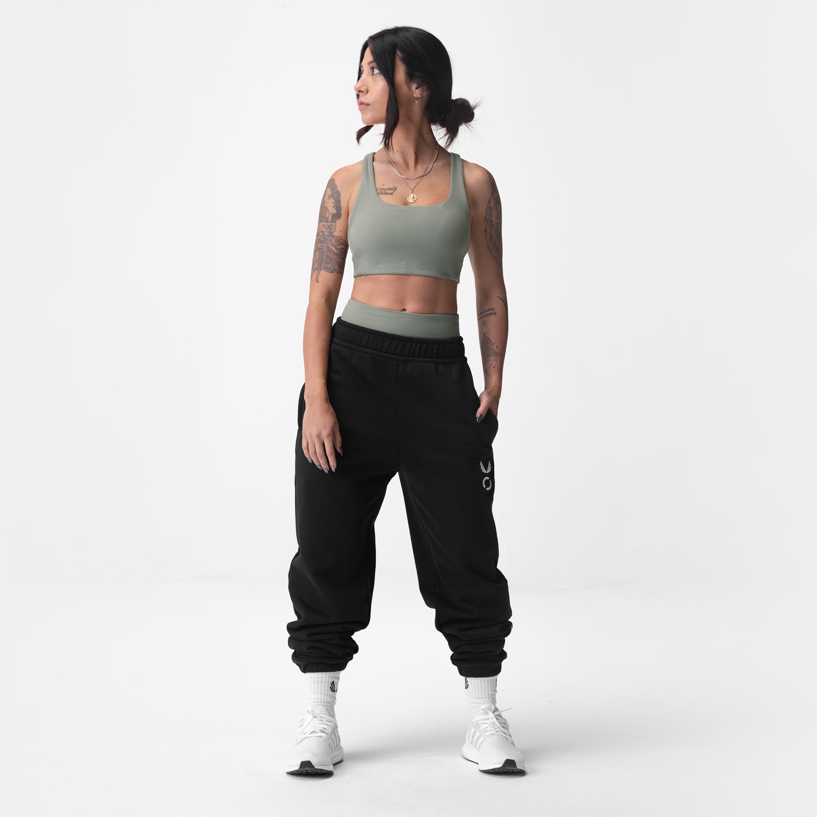 Black Sorona French-Terry Oversized Jogger worn with sage sports bra, front view