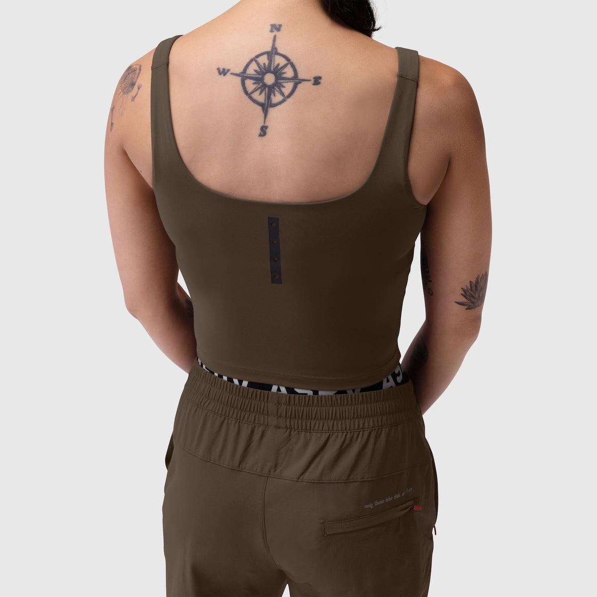 W022 LYCRA® 2-in-1 tank top in dark earth, back view on model