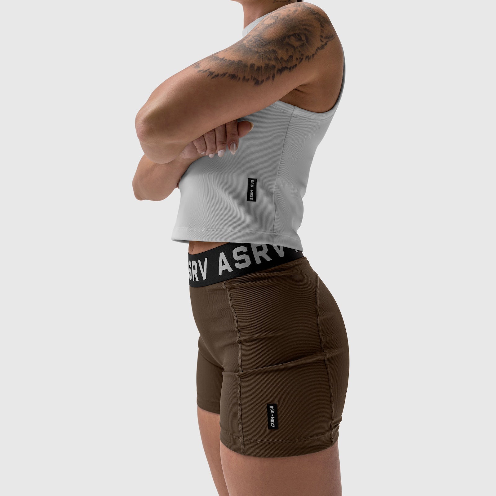 W027 Lycra Ribbed Short in dark earth, worn by model showing side view
