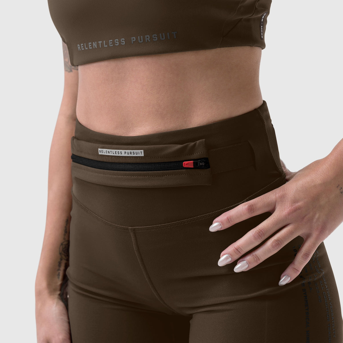LYCRA® 3-in-1 Biker Short in Dark Earth worn on model, waist detail view