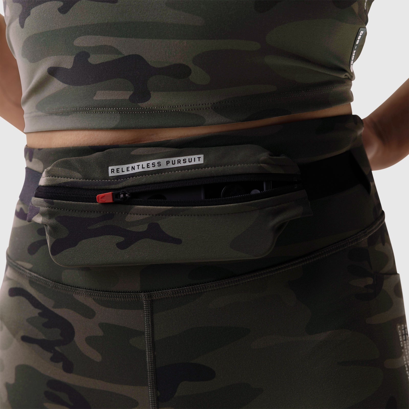 W030 LYCRA® 3-in-1 Legging in dark camo worn with utility belt, front view