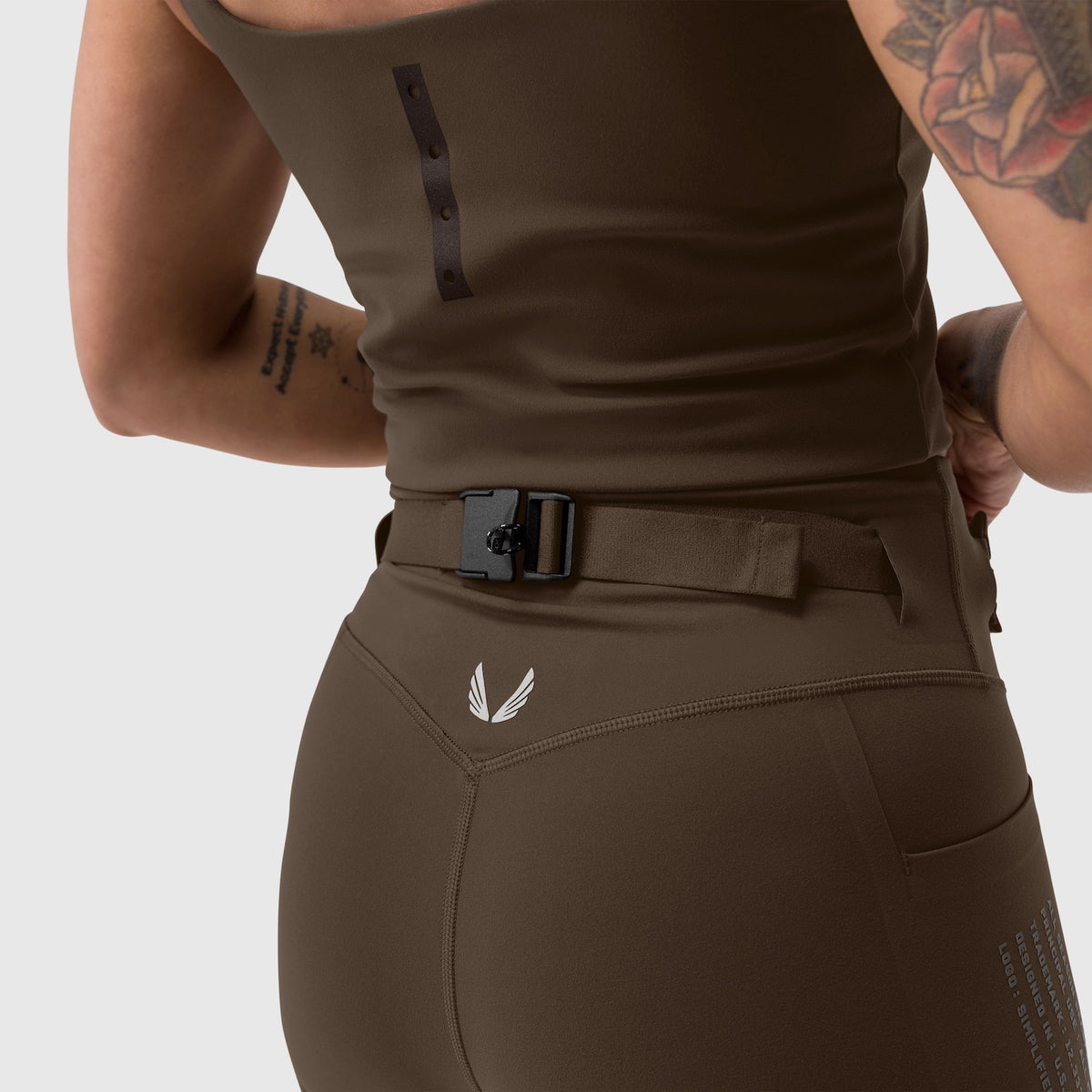 W030 LYCRA® 3-in-1 Legging in Dark Earth, back view on model with belt
