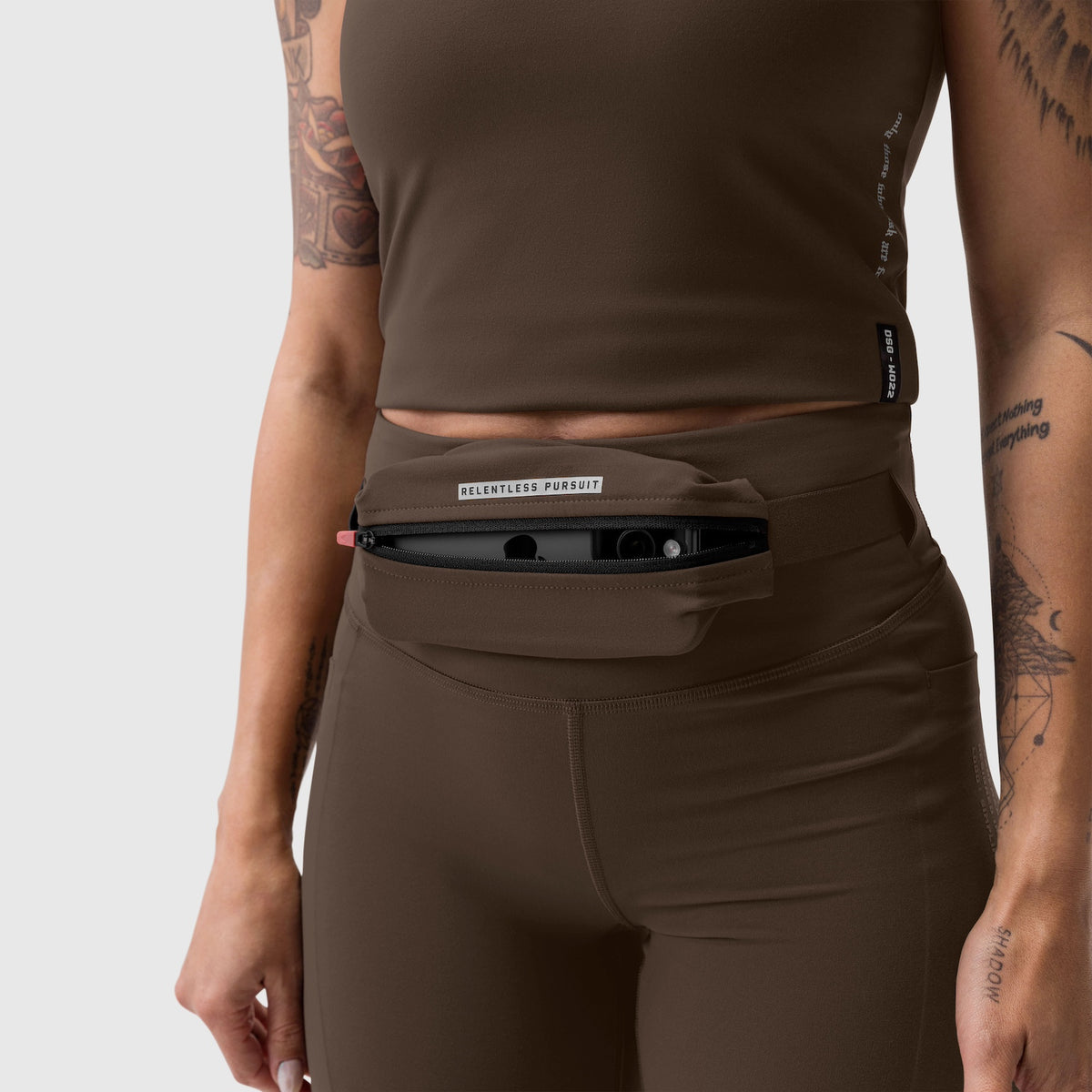 W030 Lycra 3-in-1 legging in dark earth worn with waist pouch, front view