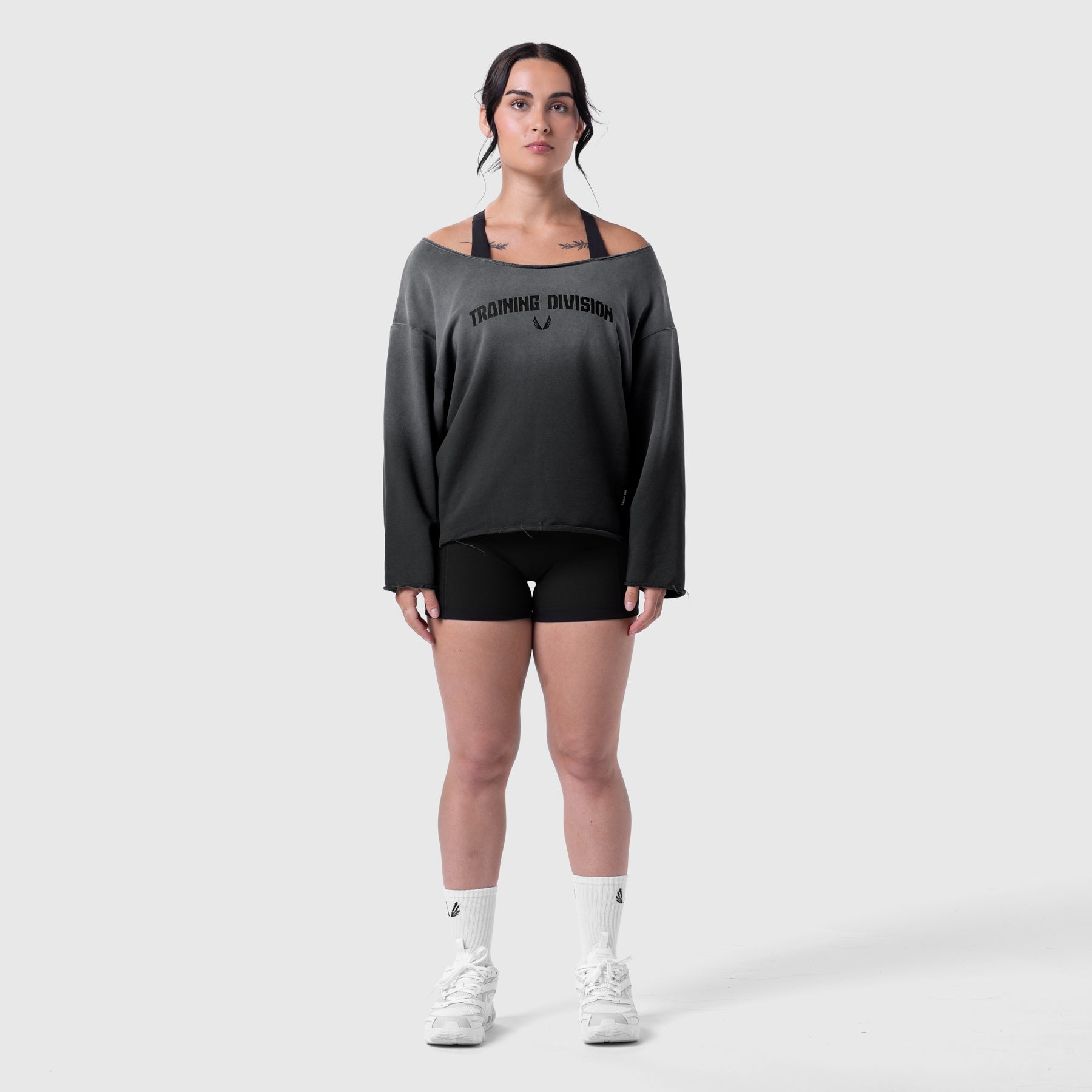 Raw Hem Oversized Crewneck in black sun fade worn with black shorts and white socks, front view