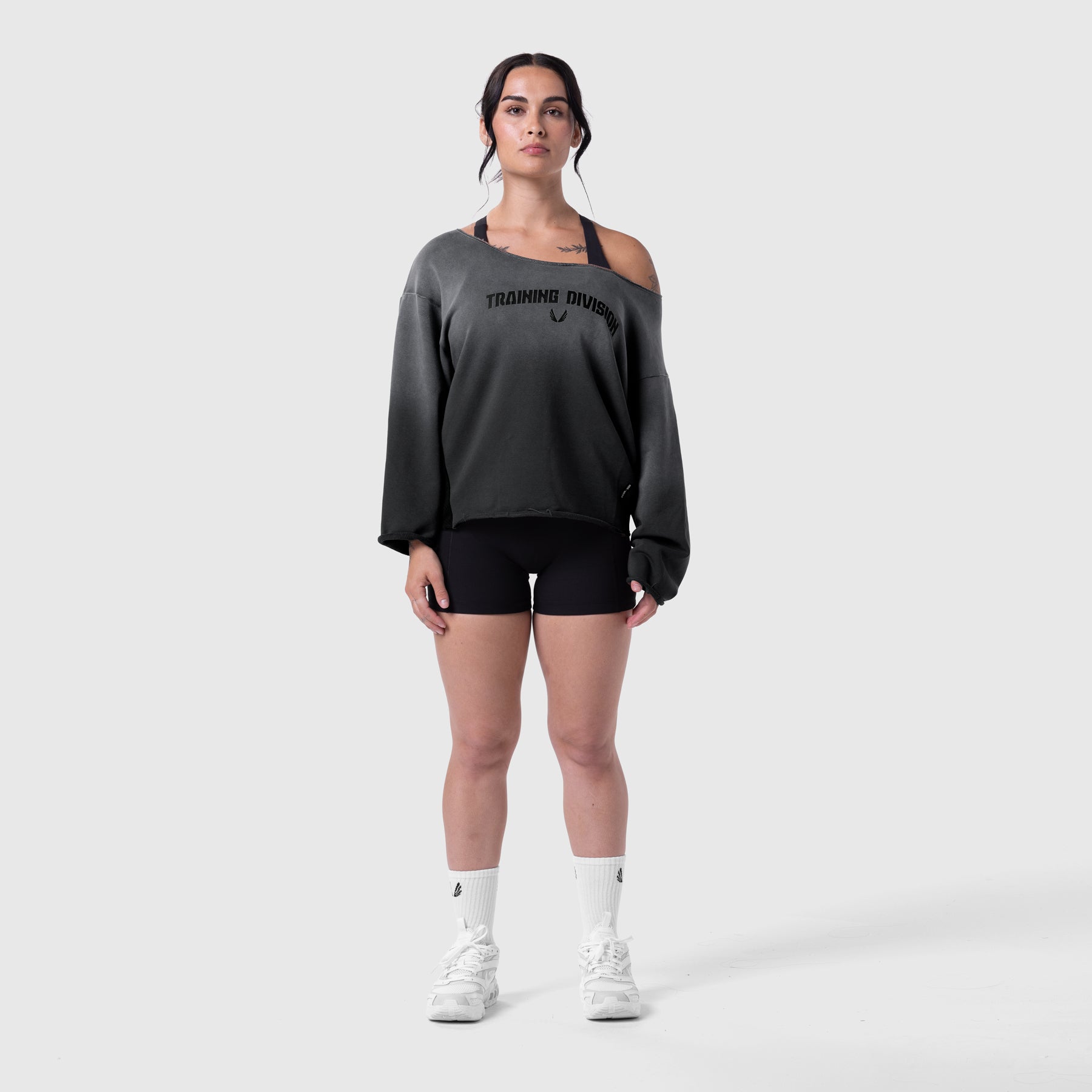 Raw Hem Oversized Crewneck in black sun fade, worn by model with black shorts and white socks