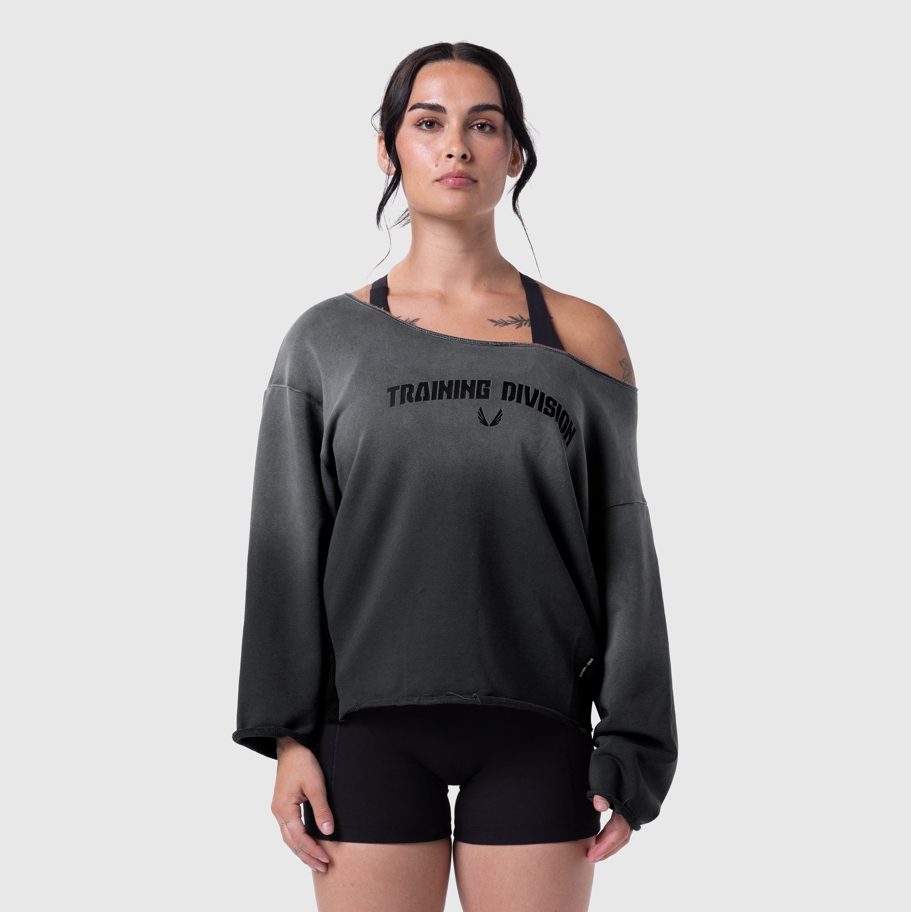Raw Hem Oversized Crewneck in black sun fade, worn by model with off-shoulder styling