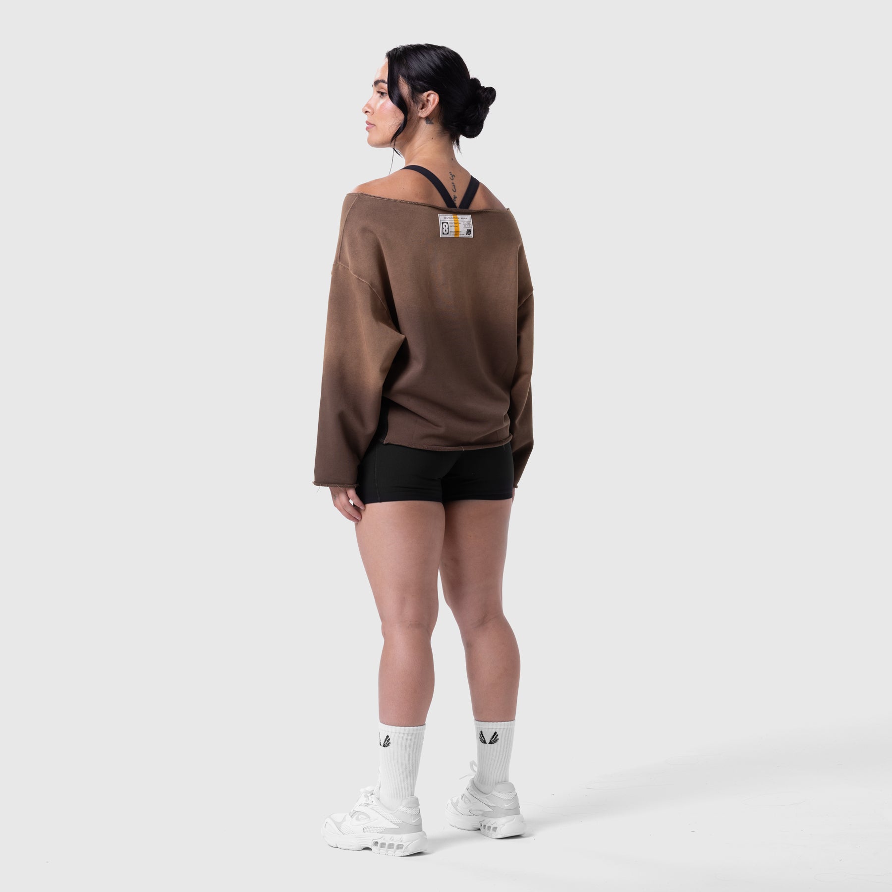 Raw Hem Oversized Crewneck in dark earth, worn with black shorts and white socks, back view
