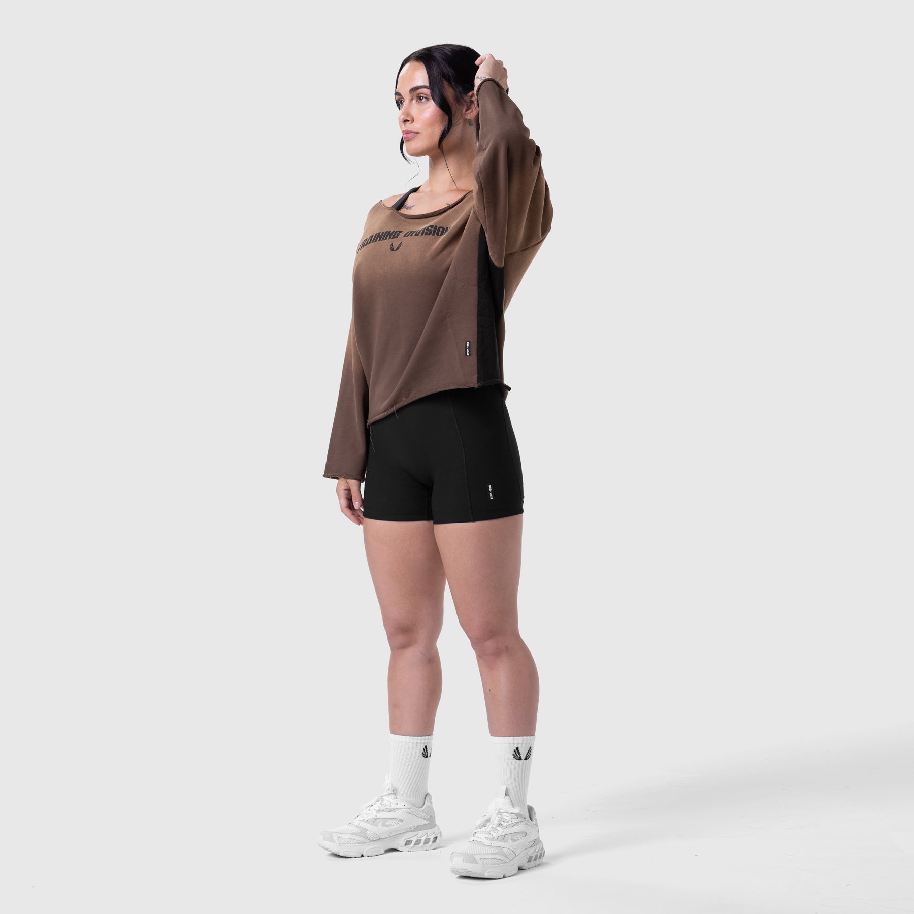 Raw Hem Oversized Crewneck in dark earth worn with black shorts, front view
