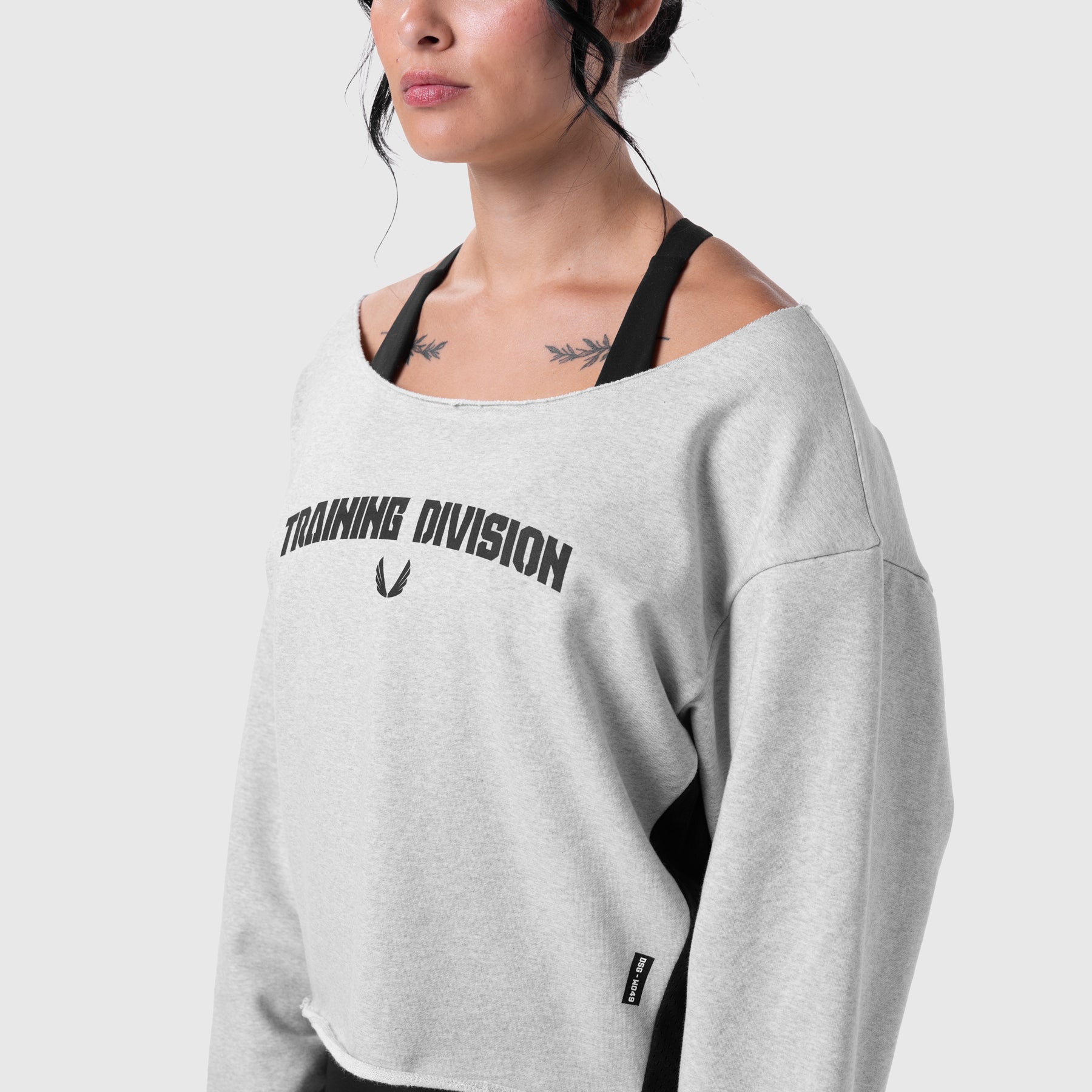 W049 Raw Hem Oversized Crewneck in heather grey worn by model with sports bra, front view