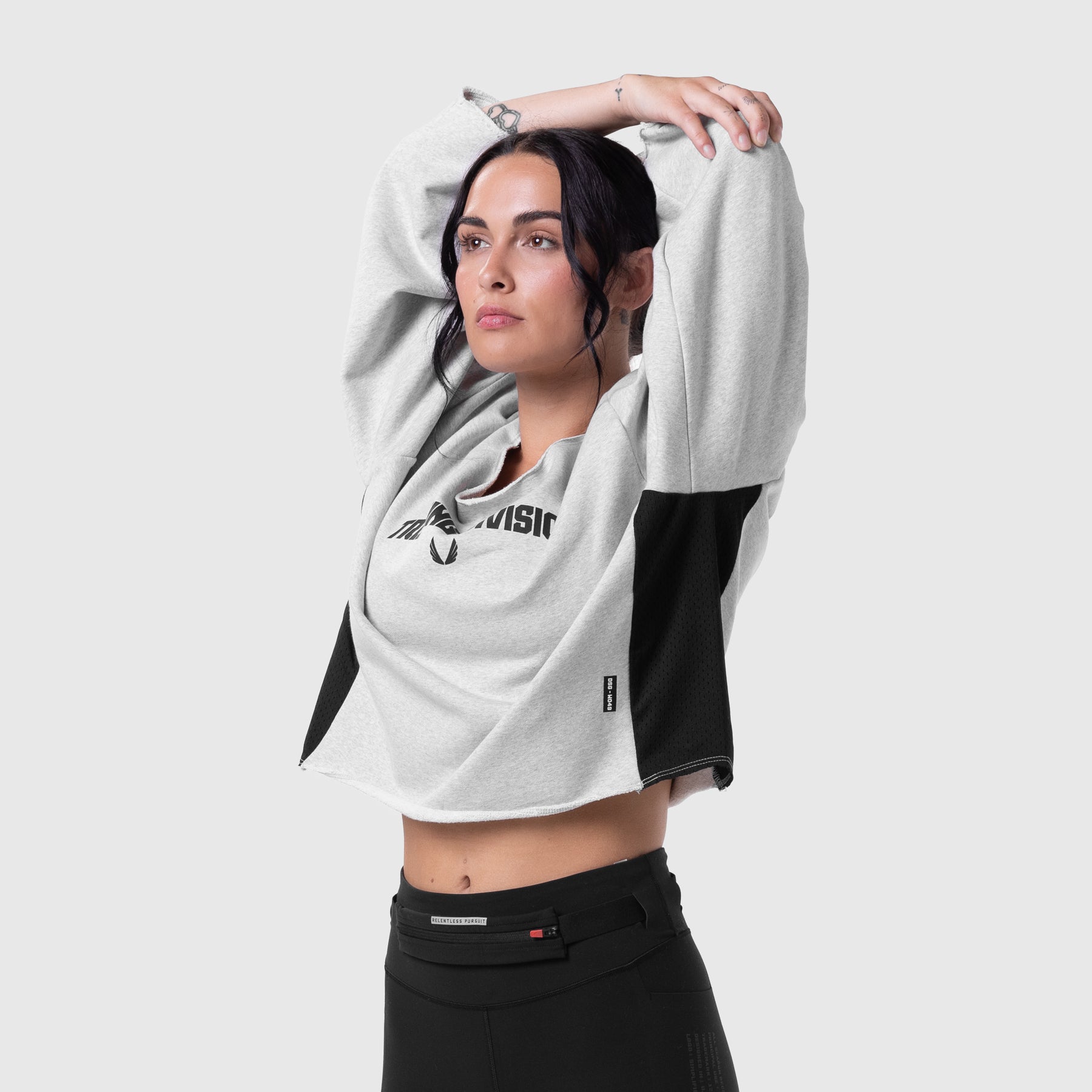 Raw Hem Oversized Crewneck in heather grey and black, worn by model with arms raised