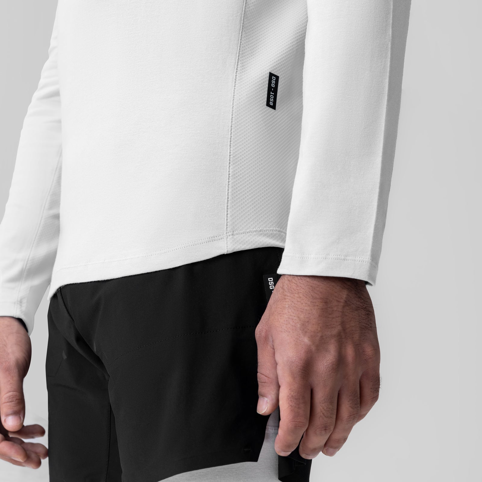 White Creora® Cotton Modal Long Sleeve worn with black shorts, side view detail