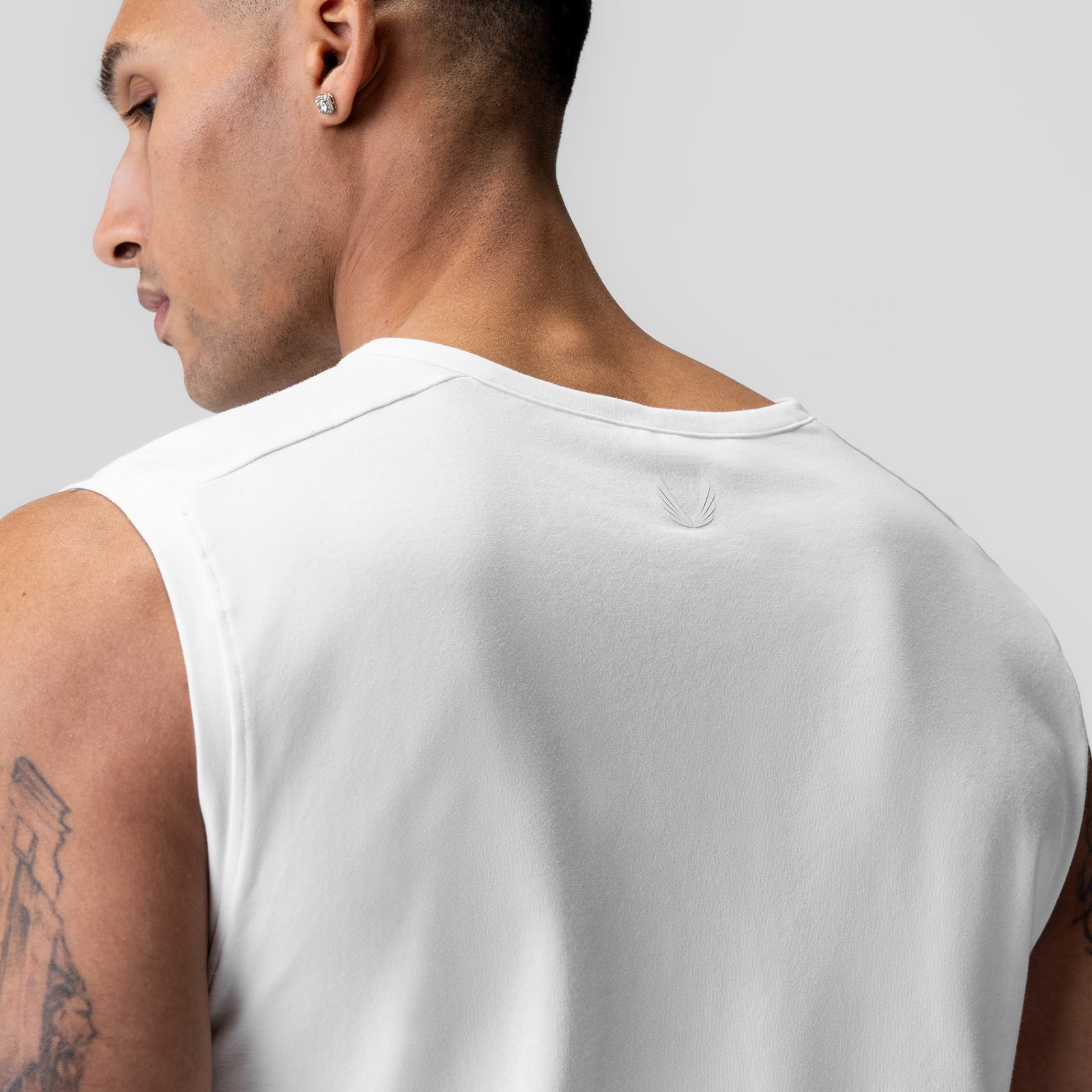 Creora® Cotton Modal Cutoff Tank in white, worn by model shown from behind