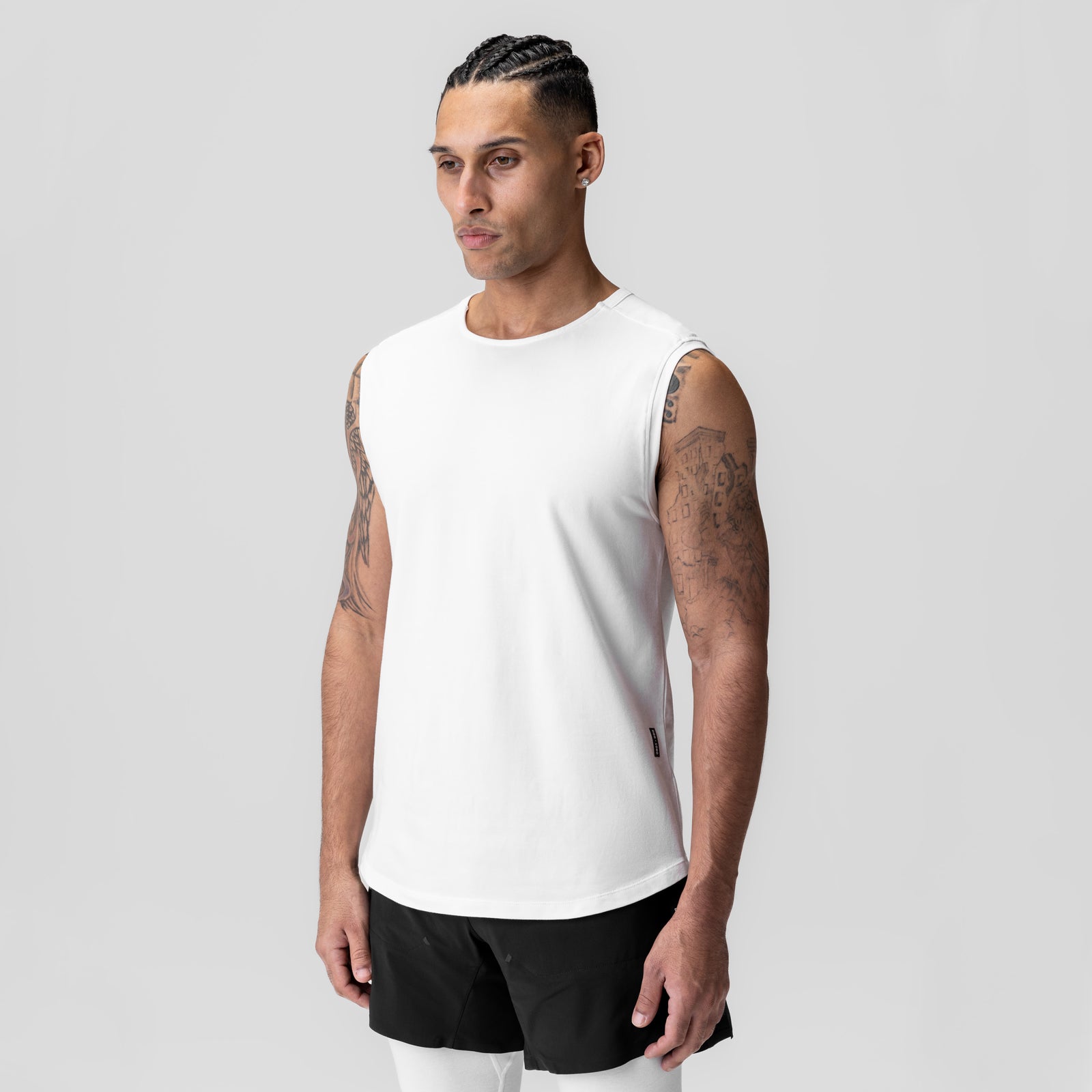 White Creora® Cotton Modal Cutoff Tank worn by model, front view with black shorts