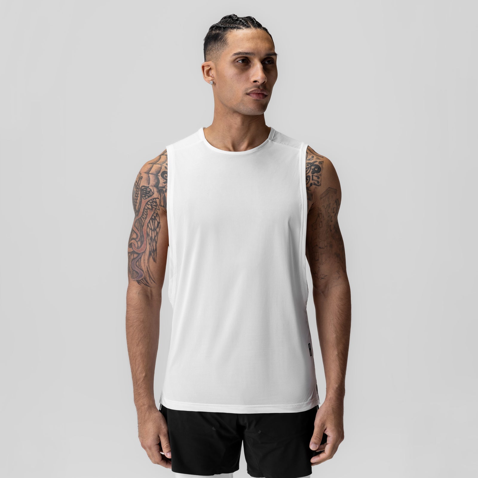 Ice-Skin™ Muscle Tank in white worn by model, front view