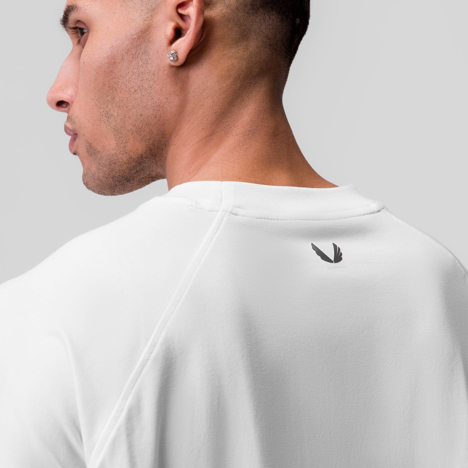 White Supima® 3/4-sleeve oversized tee worn by model, back view