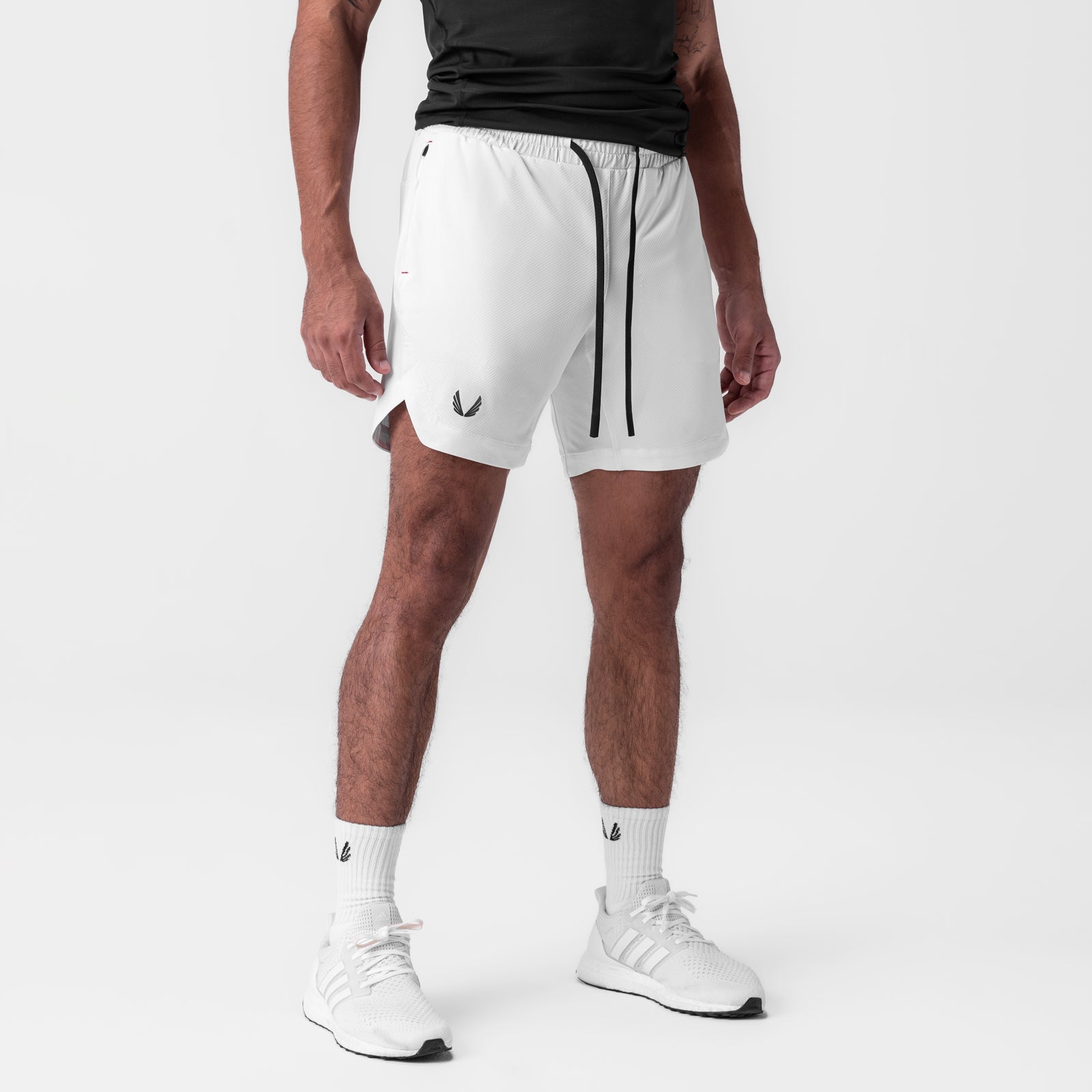 AeroSilver 7" Linerless Short in white, worn by model with white socks and sneakers