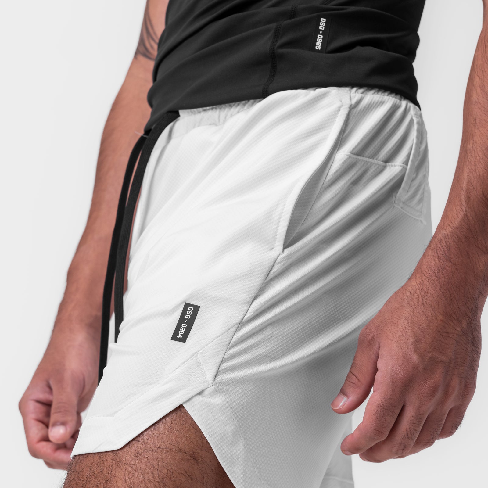 AeroSilver 7" linerless shorts in white, worn on model, side view