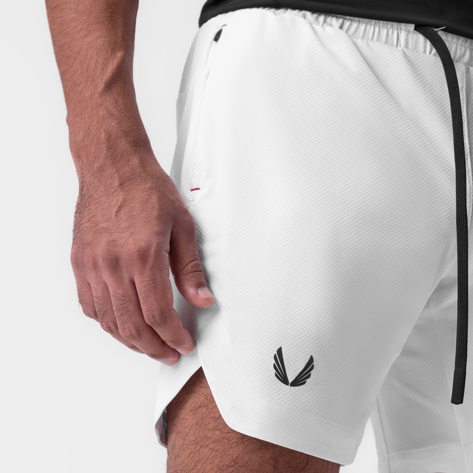 White AeroSilver 7" linerless shorts on model, side view showing fit and logo detail