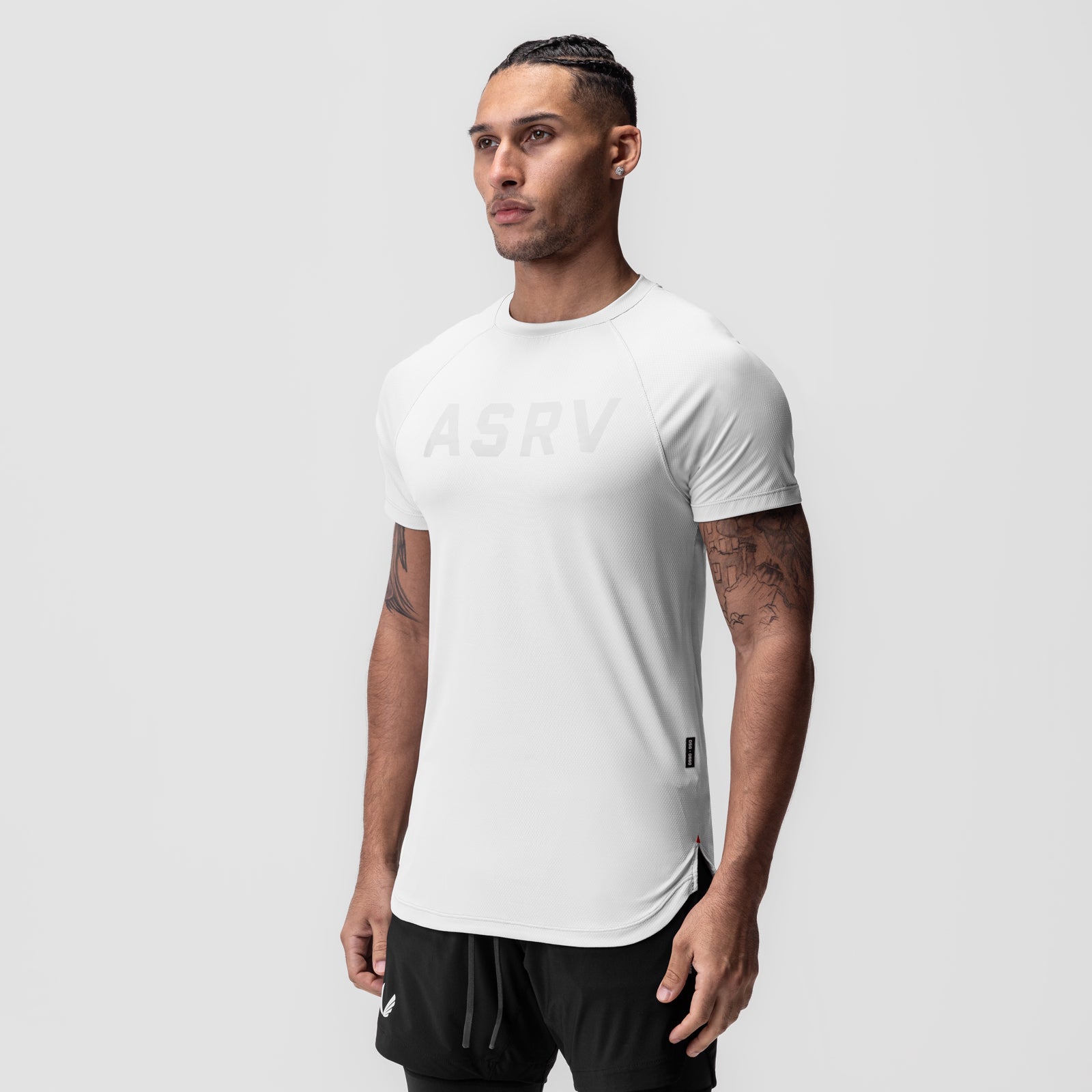 White AeroSilver Established Tee worn by male model with black joggers, front view
