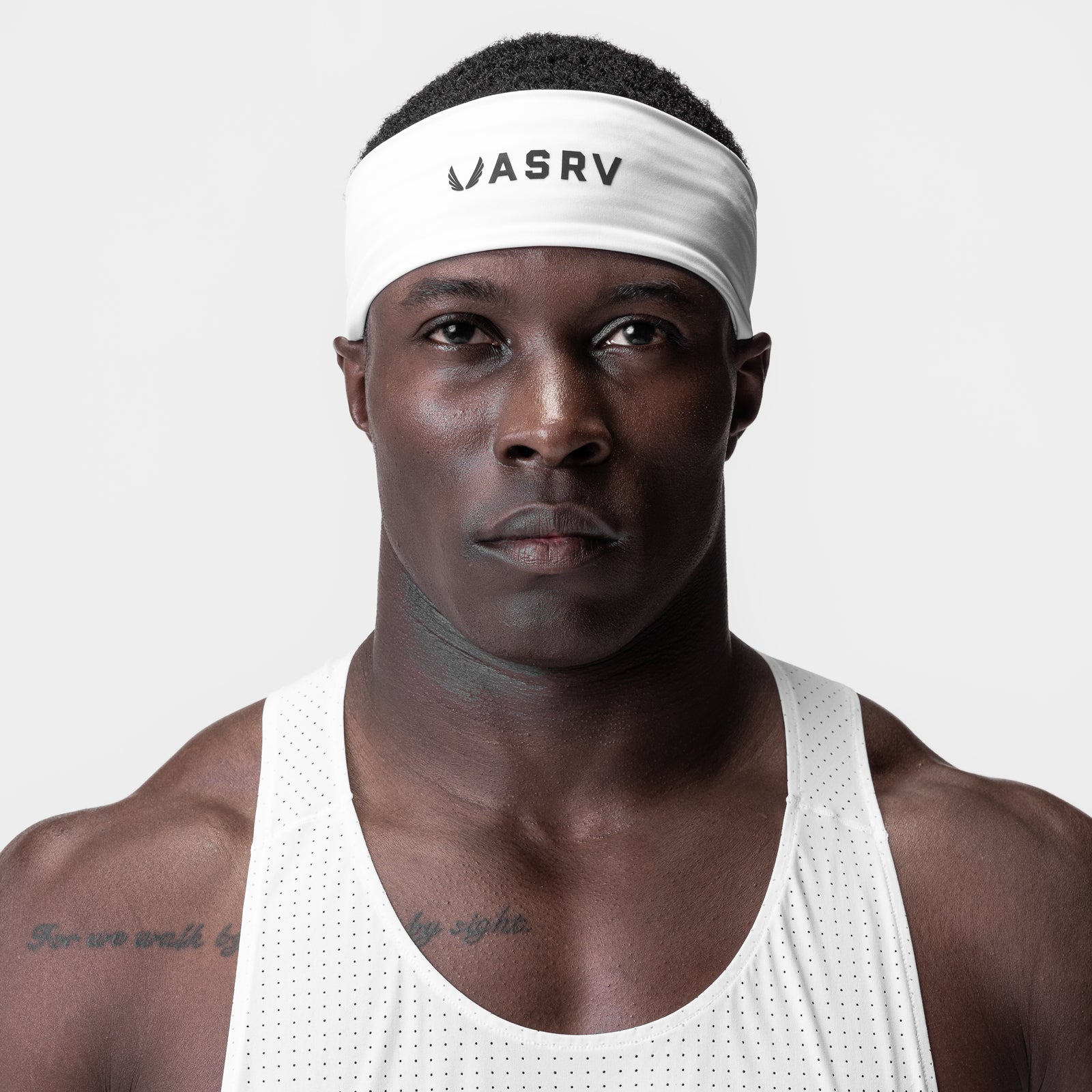 WarpFlexx® Headband in white worn by male model in white tank top, front view