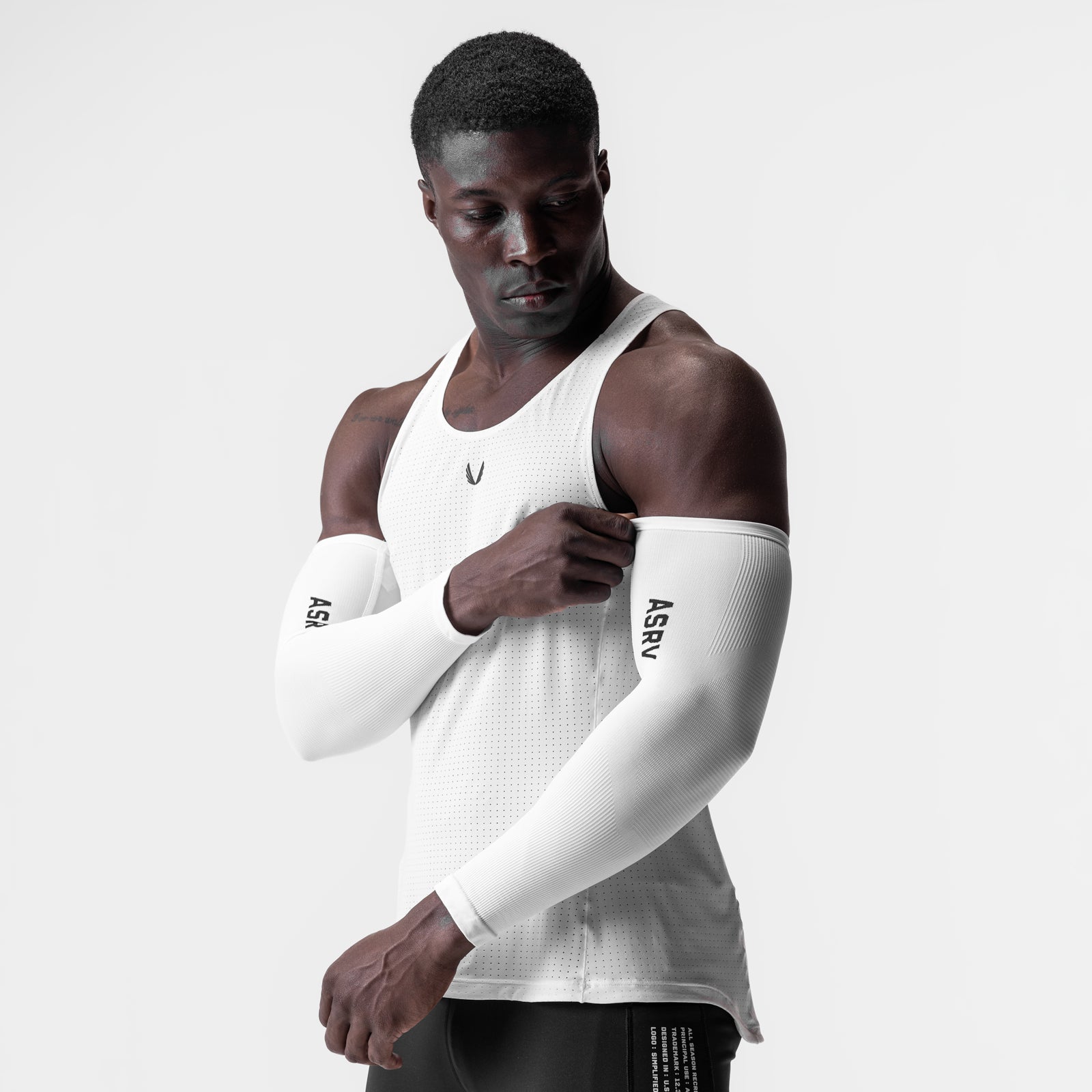 White body-mapped arm sleeves on model, front view