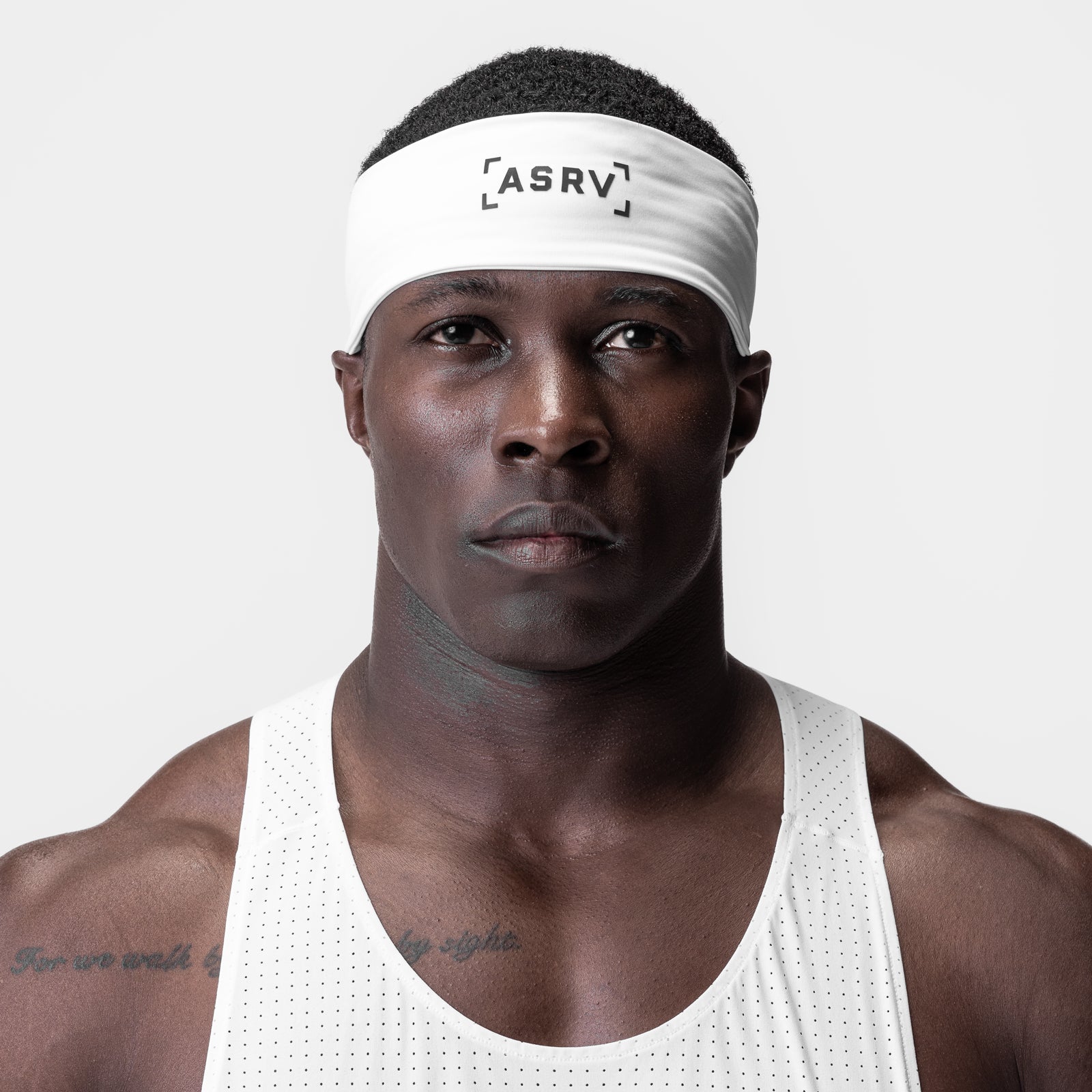 WarpFlexx Headband in white with bracket logo, worn by male model in white tank top