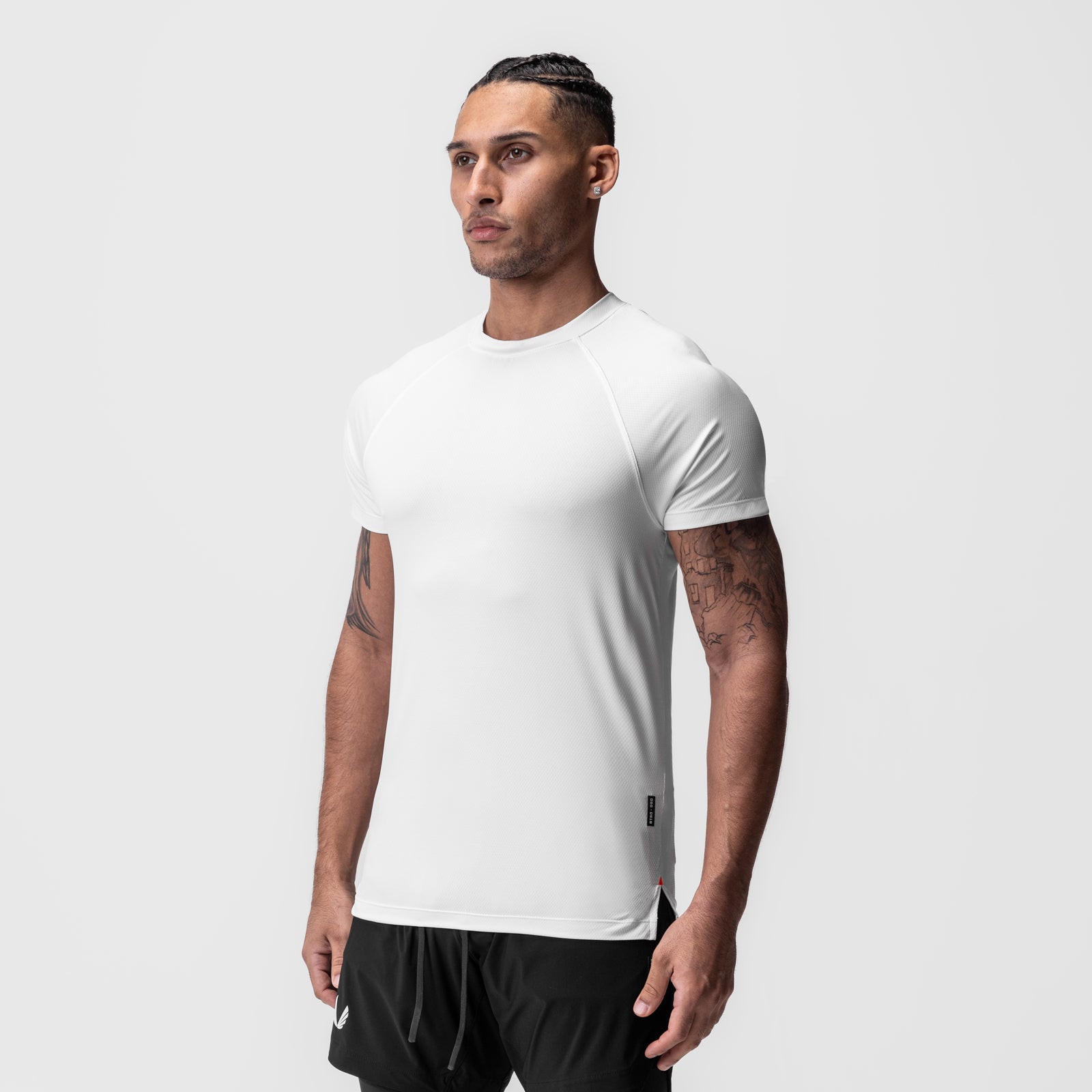 AeroSilver® Fitted Tee in white, worn by male model in side profile view