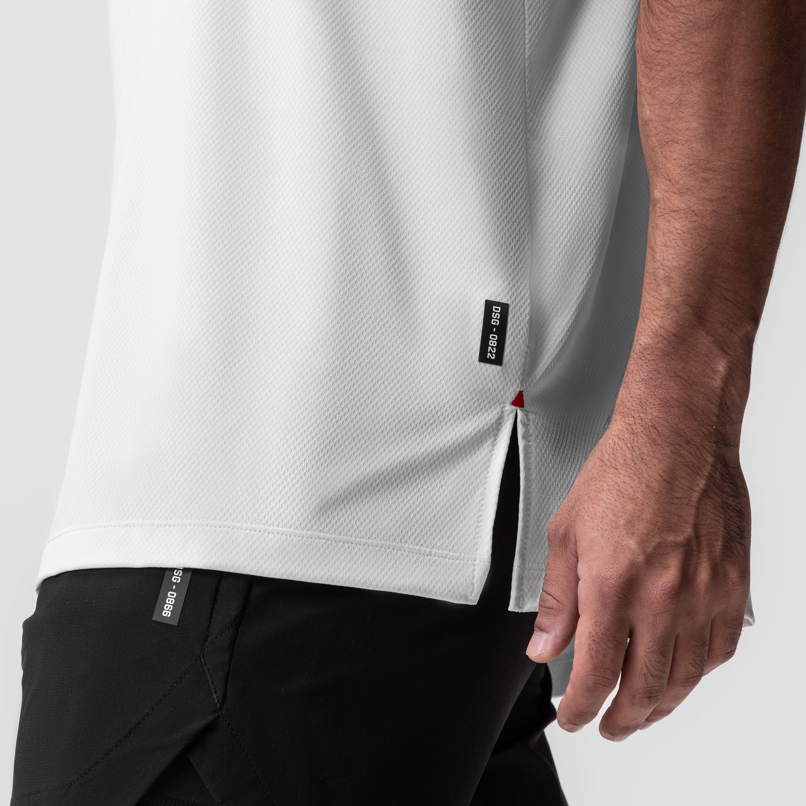 AeroSilver Oversized Tee in white, worn by model showing side seam detail