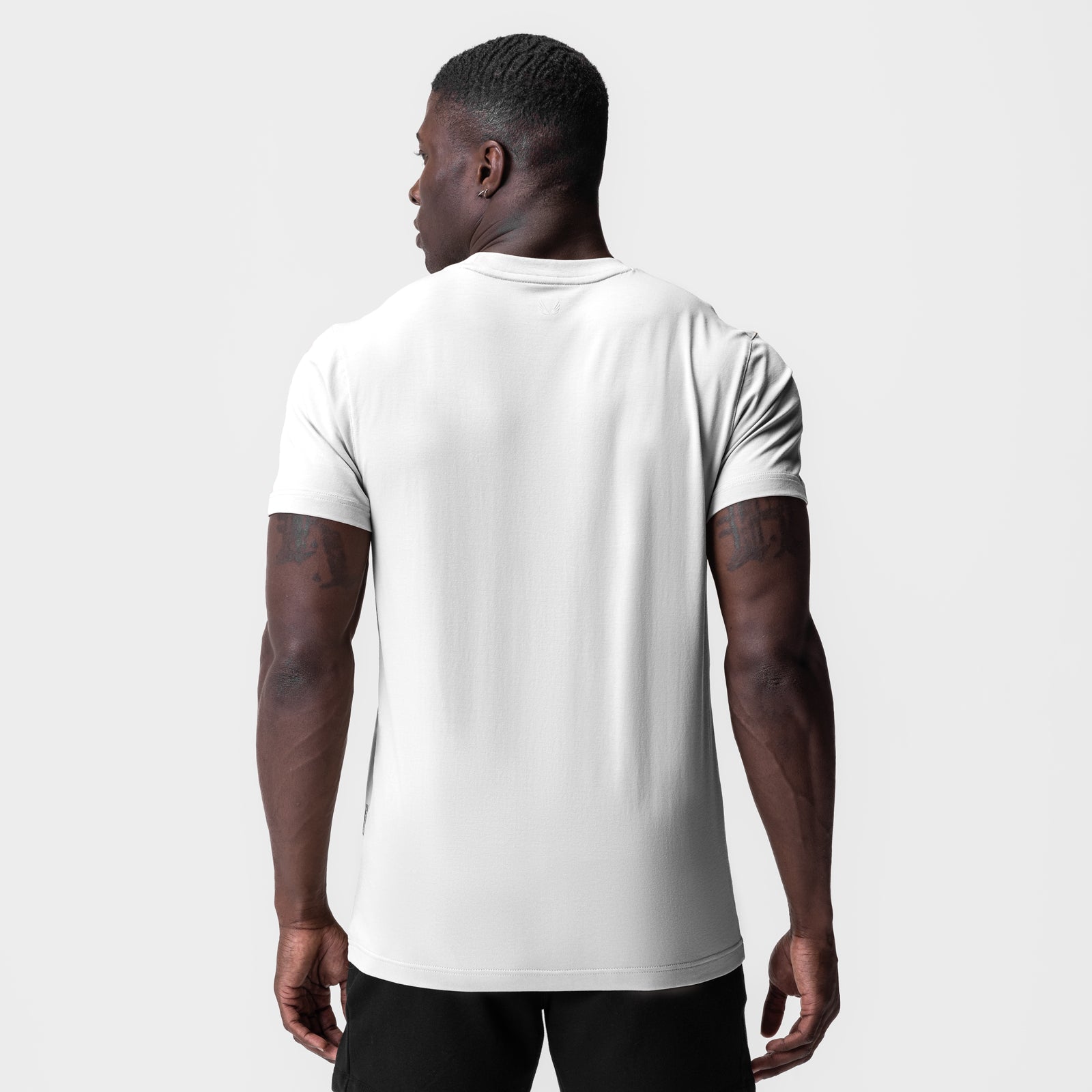 White Supima Essential Tee worn by model, back view