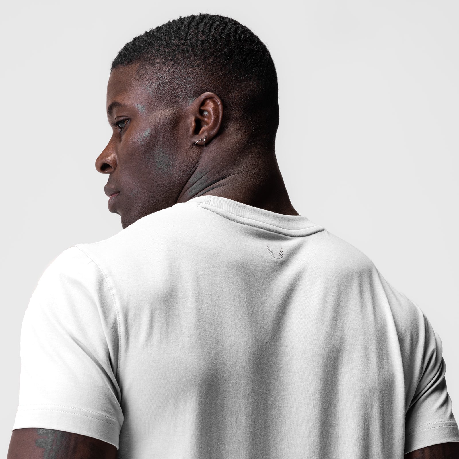 White Supima Essential Tee worn by model, back view