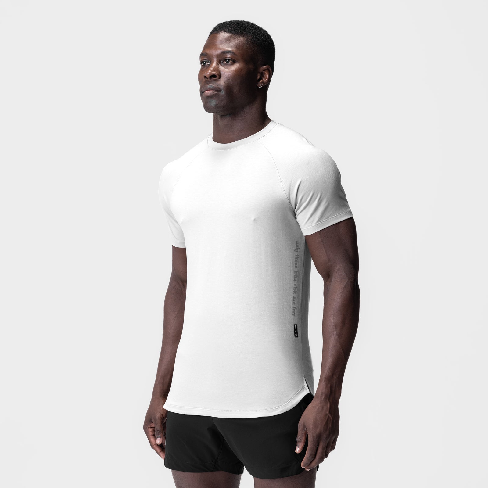 White Supima Established Tee worn by model, paired with black shorts, front side view