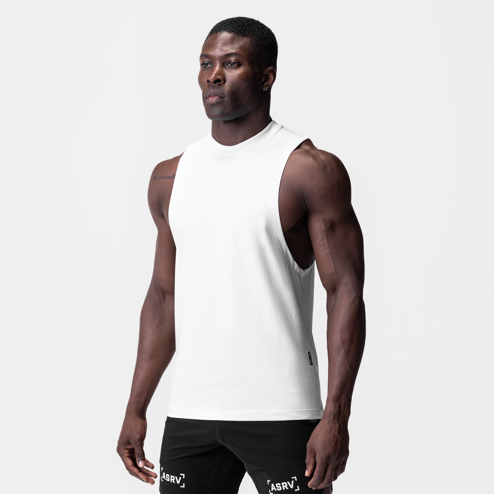 White Supima® Muscle Tank worn by male model, front view