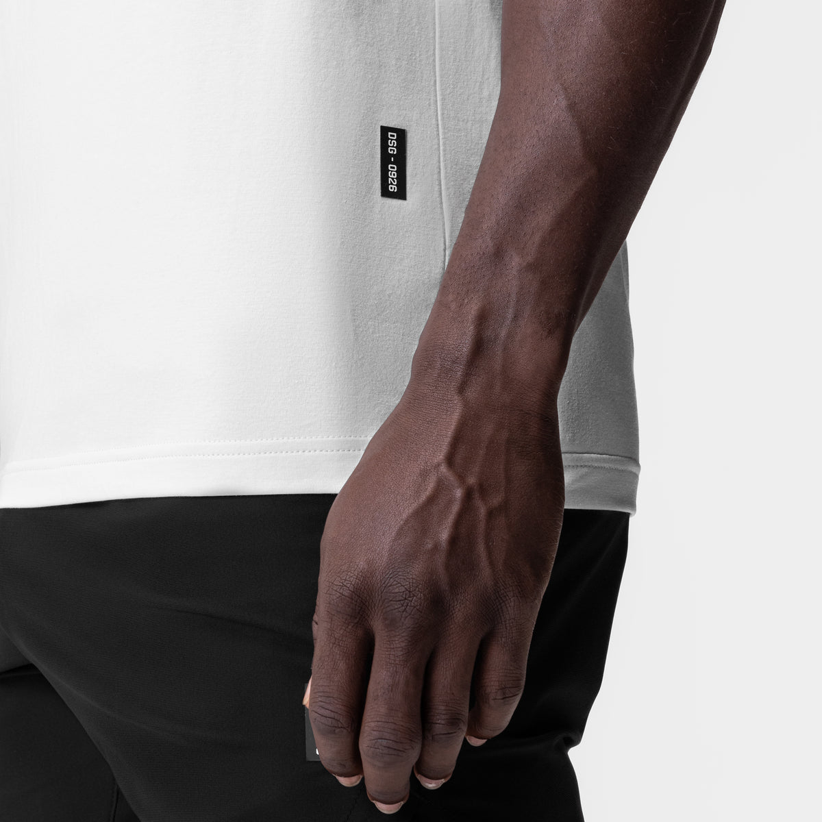 White Supima® Muscle Tank worn by model, side view detail