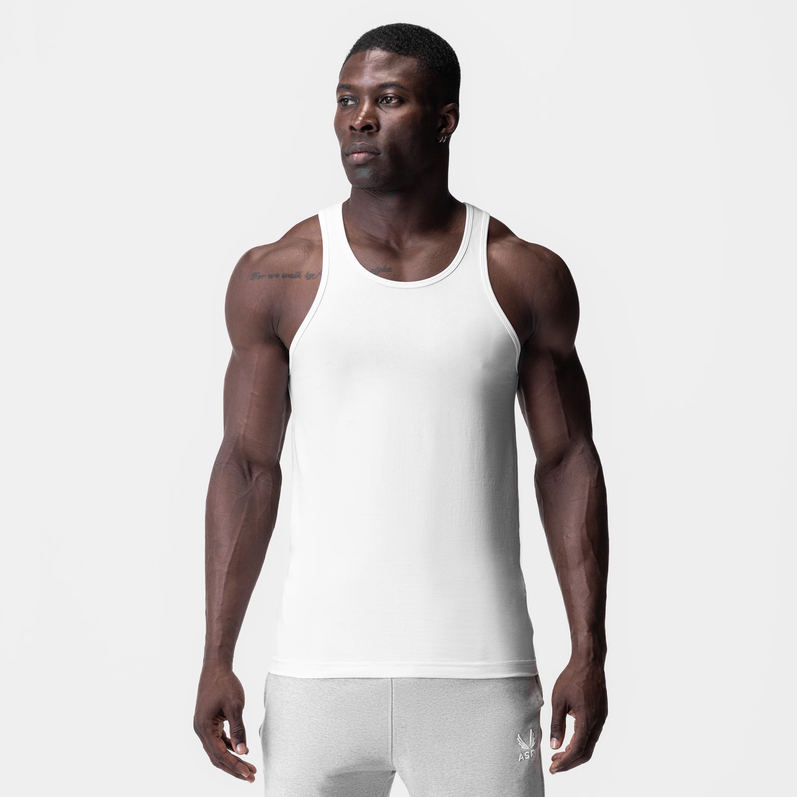 White Supima Essential Slim Tank worn by model, front view