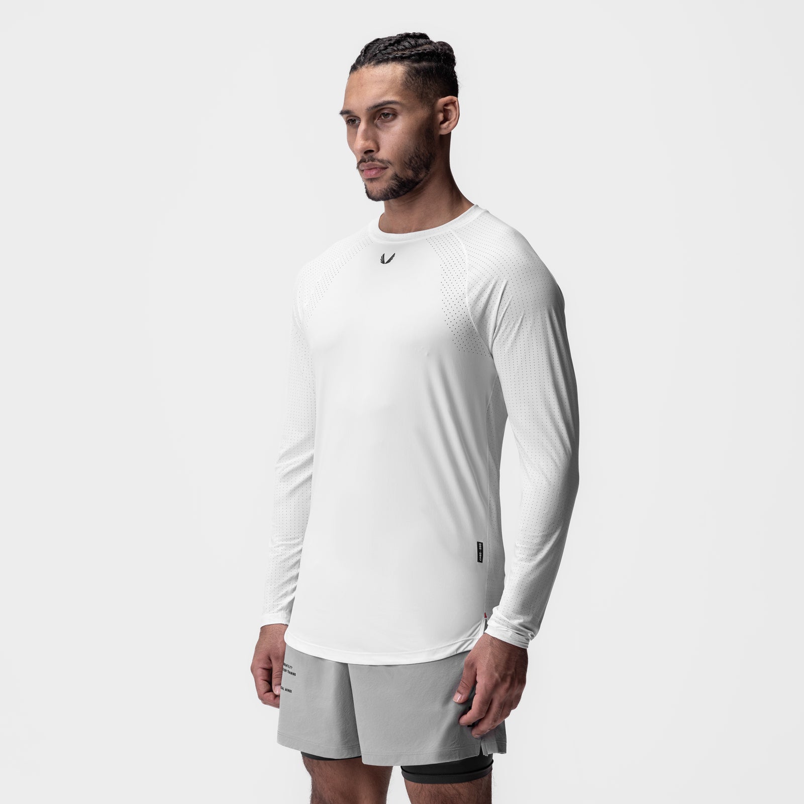 Laser-Vent™ Established Long Sleeve in white, worn by model with grey shorts, side view