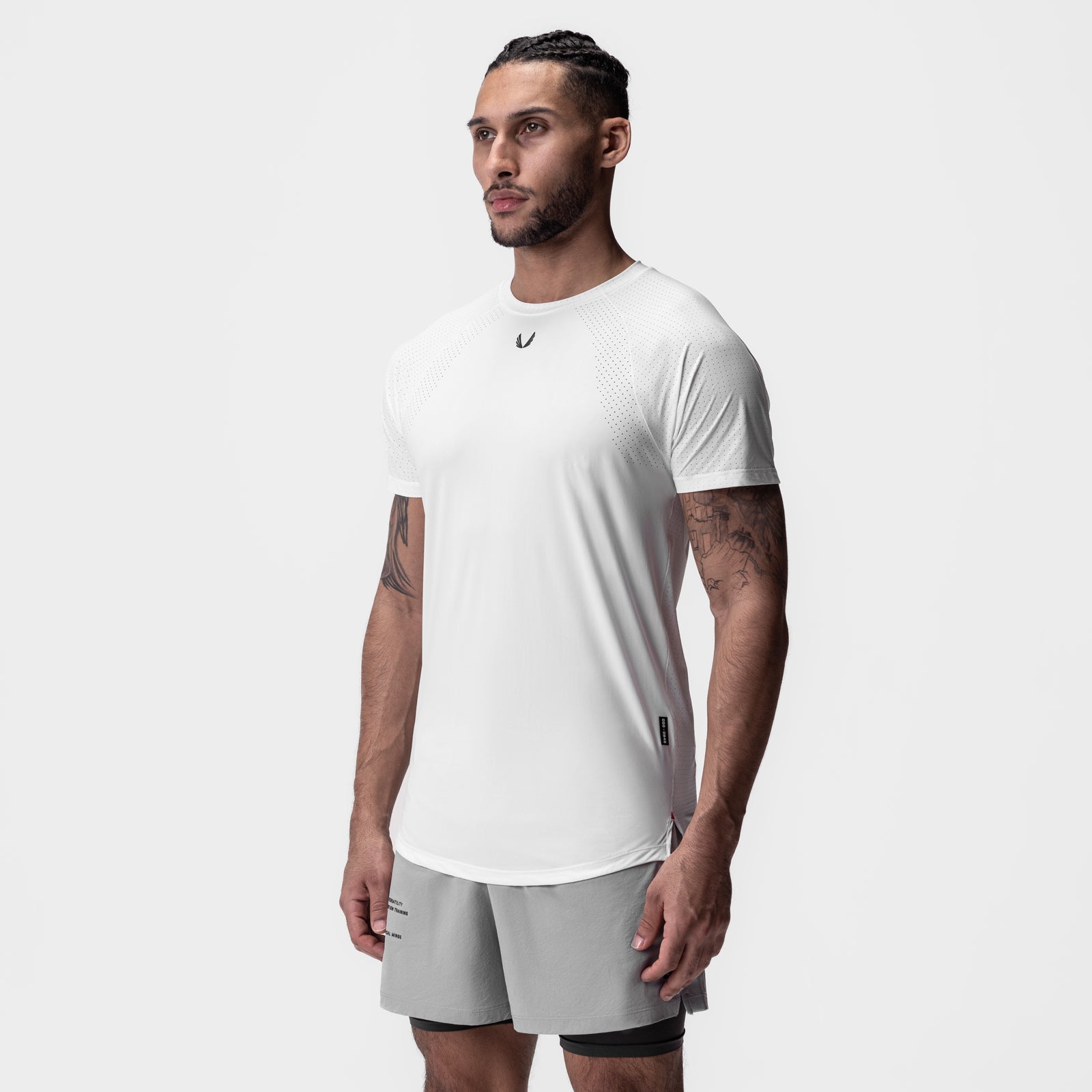 White Laser-Vent Established Tee worn by model with grey shorts, side view