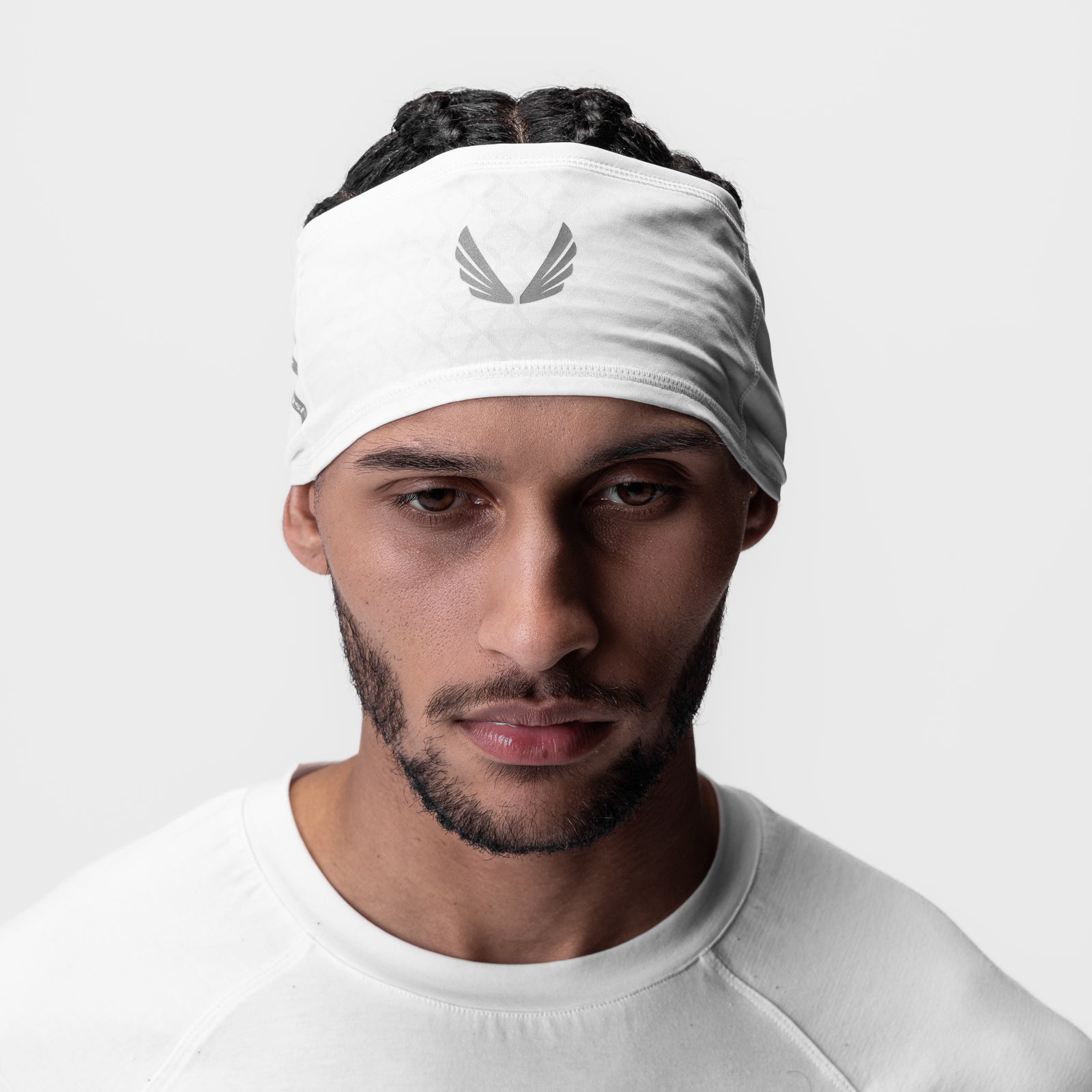 White reflective wings headband worn by model, front view
