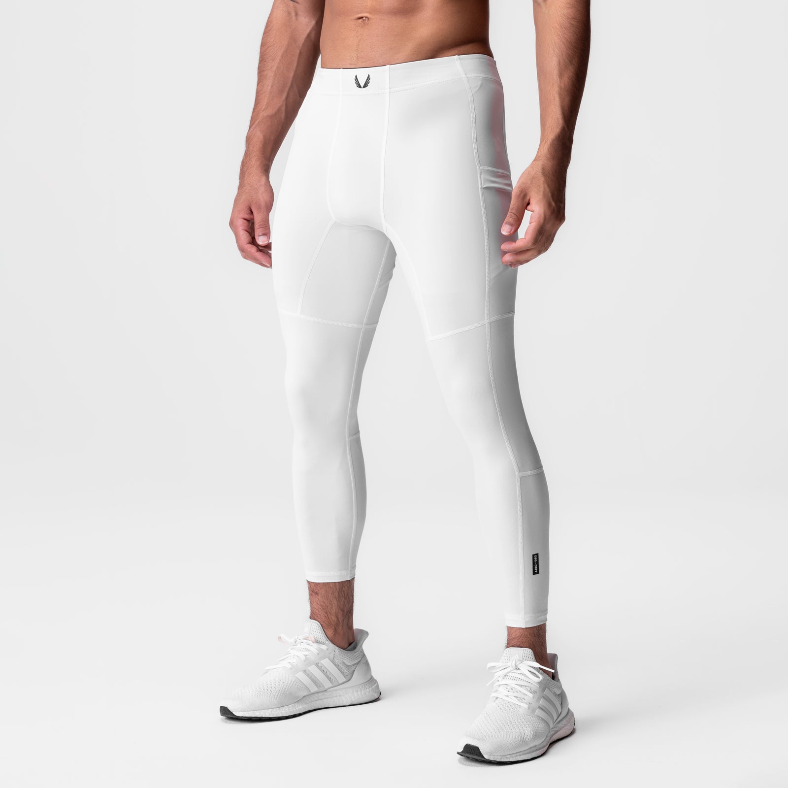 White WarpFlexx-Lite 3/4-length legging on model, side view