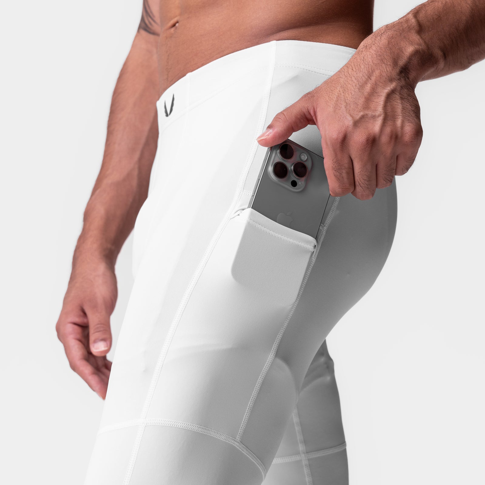 WarpFlexx-Lite® 3/4-Length Legging in white, model demonstrating side pocket with phone