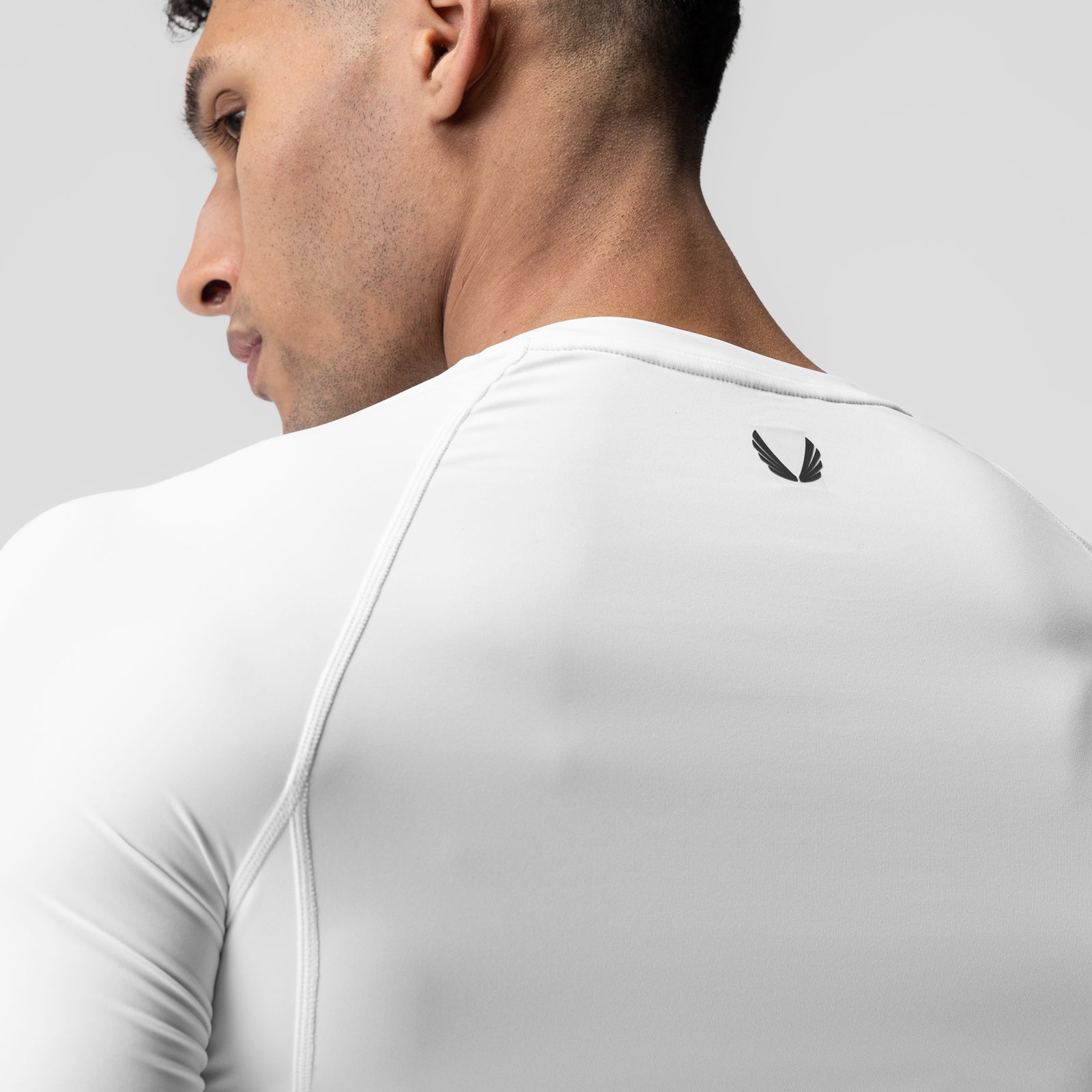 WarpFlexx-Lite Half-Sleeve Baselayer in white, worn by model in profile view