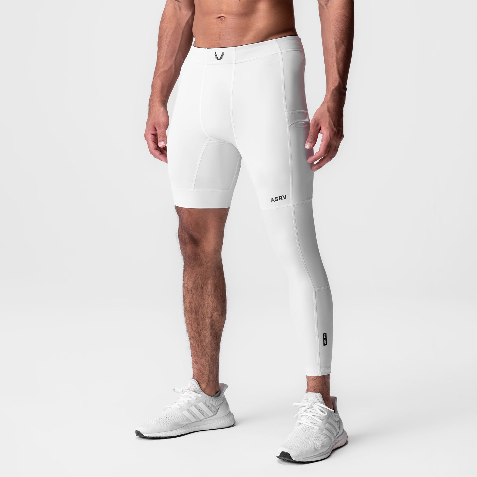 WarpFlexx-Lite Single Legging in white, model wearing asymmetrical shorts and legging combo