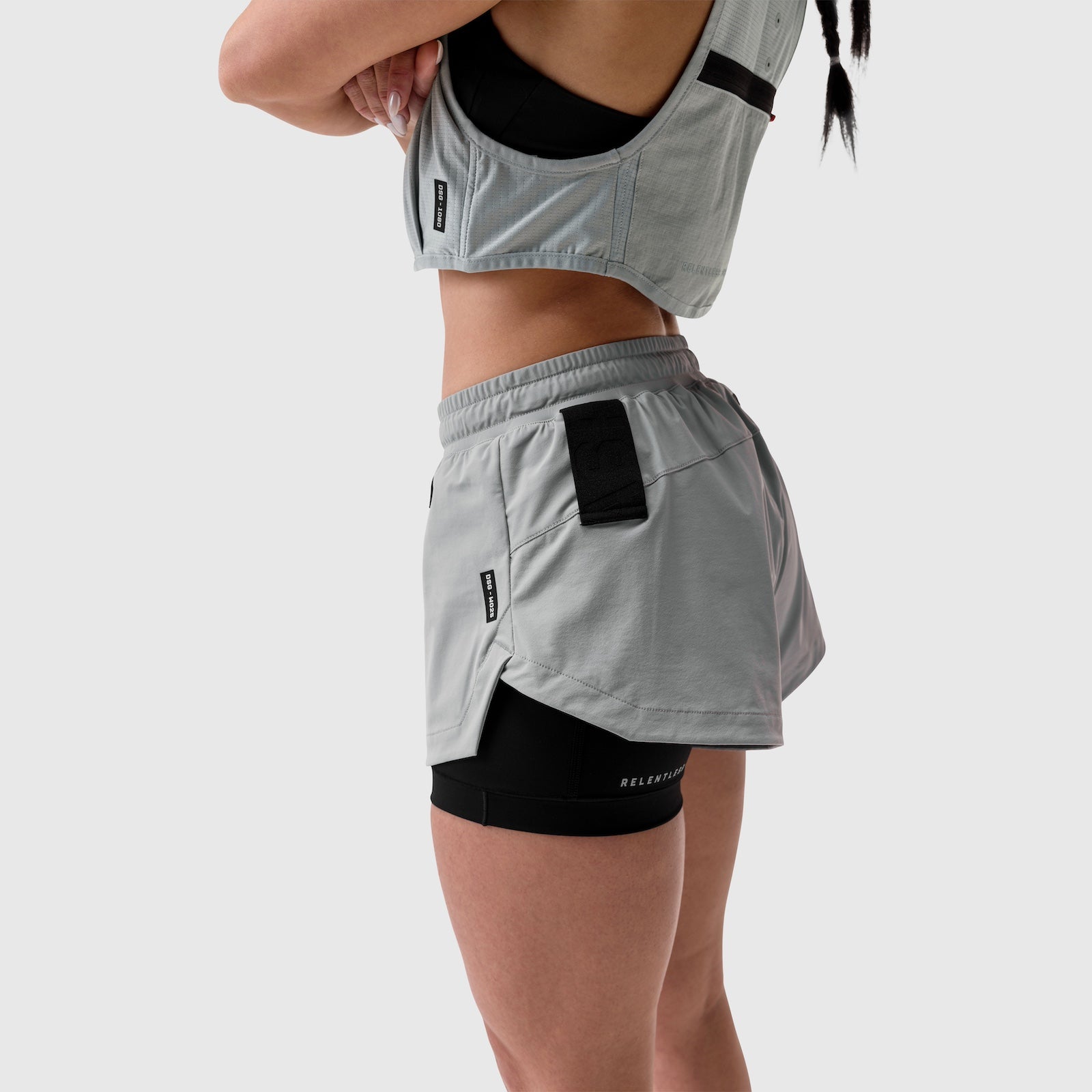 W025 Tetra-Lite Liner Short in slate grey worn with matching sports bra, side view