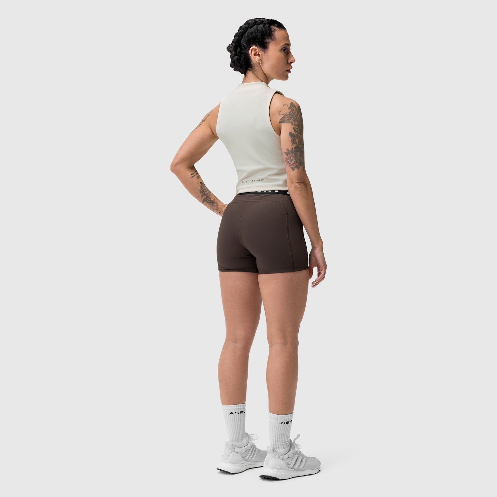Ivory cream ribbed mockneck tank worn with brown shorts, back view