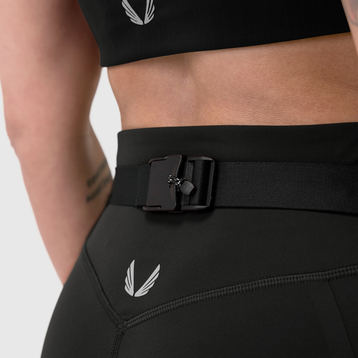 LYCRA® 3-in-1 Biker Short in black worn on model, detail view of waistband and belt