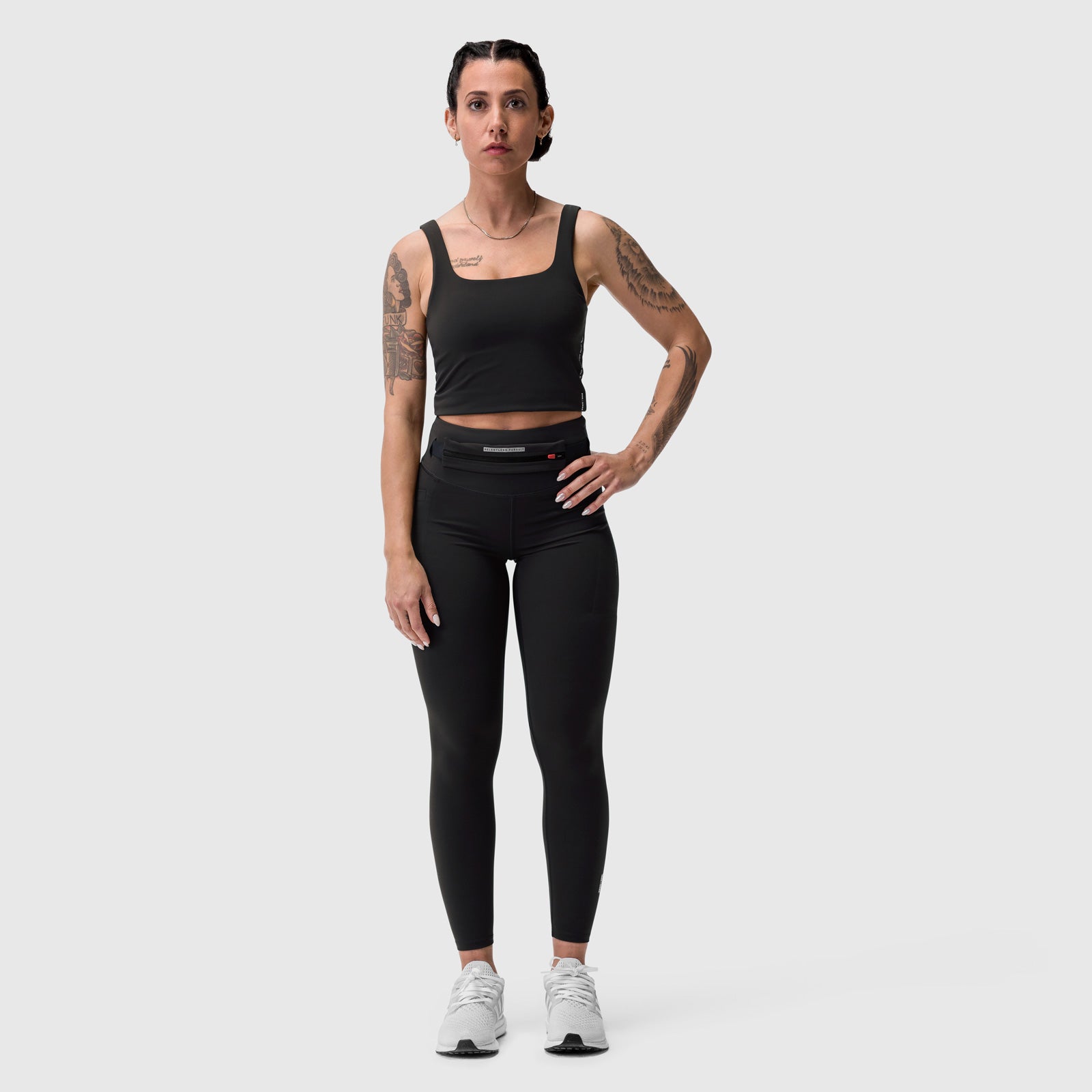 LYCRA® 3-in-1 Legging in black, worn by model standing against light background