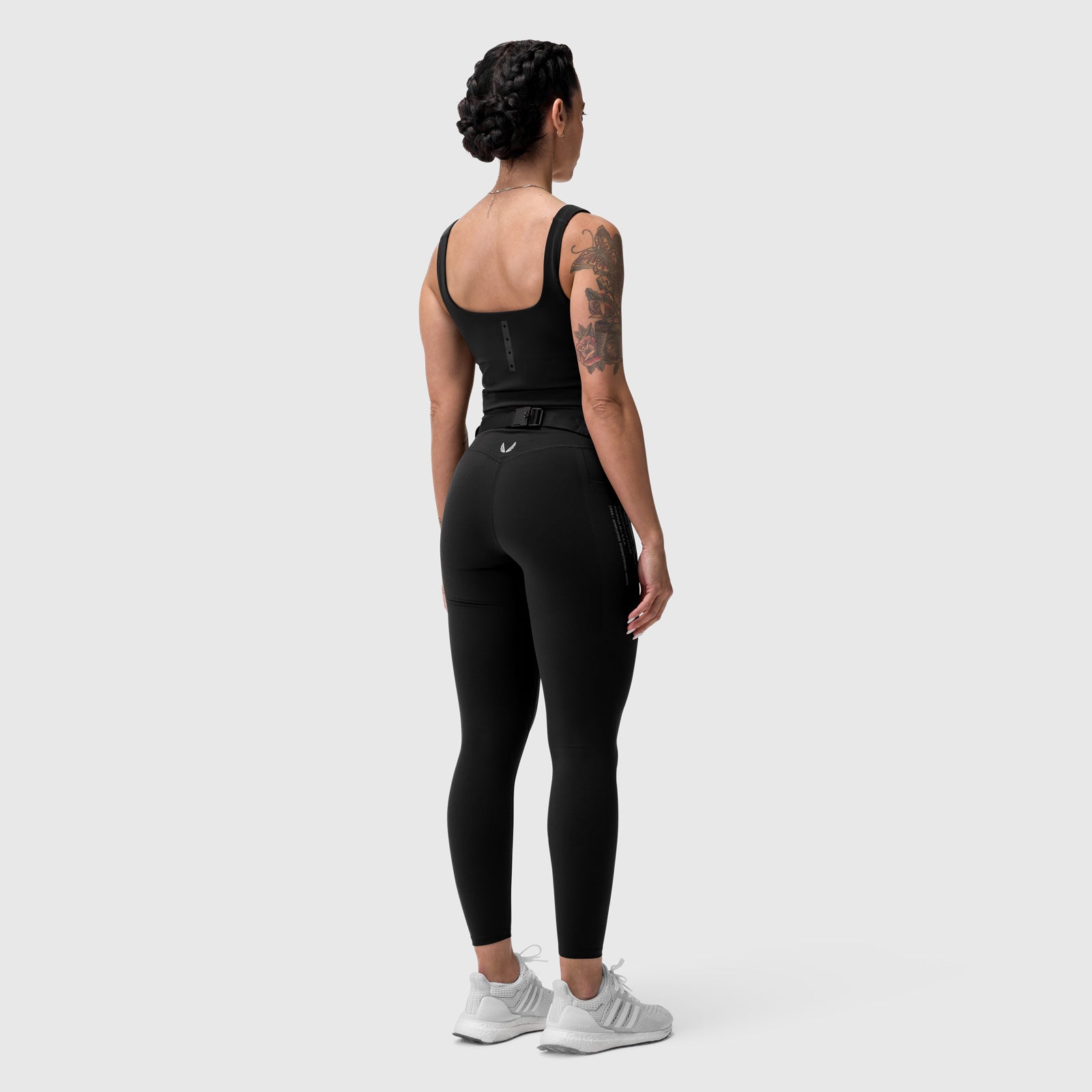 Black LYCRA® 3-in-1 Legging worn by model, back view
