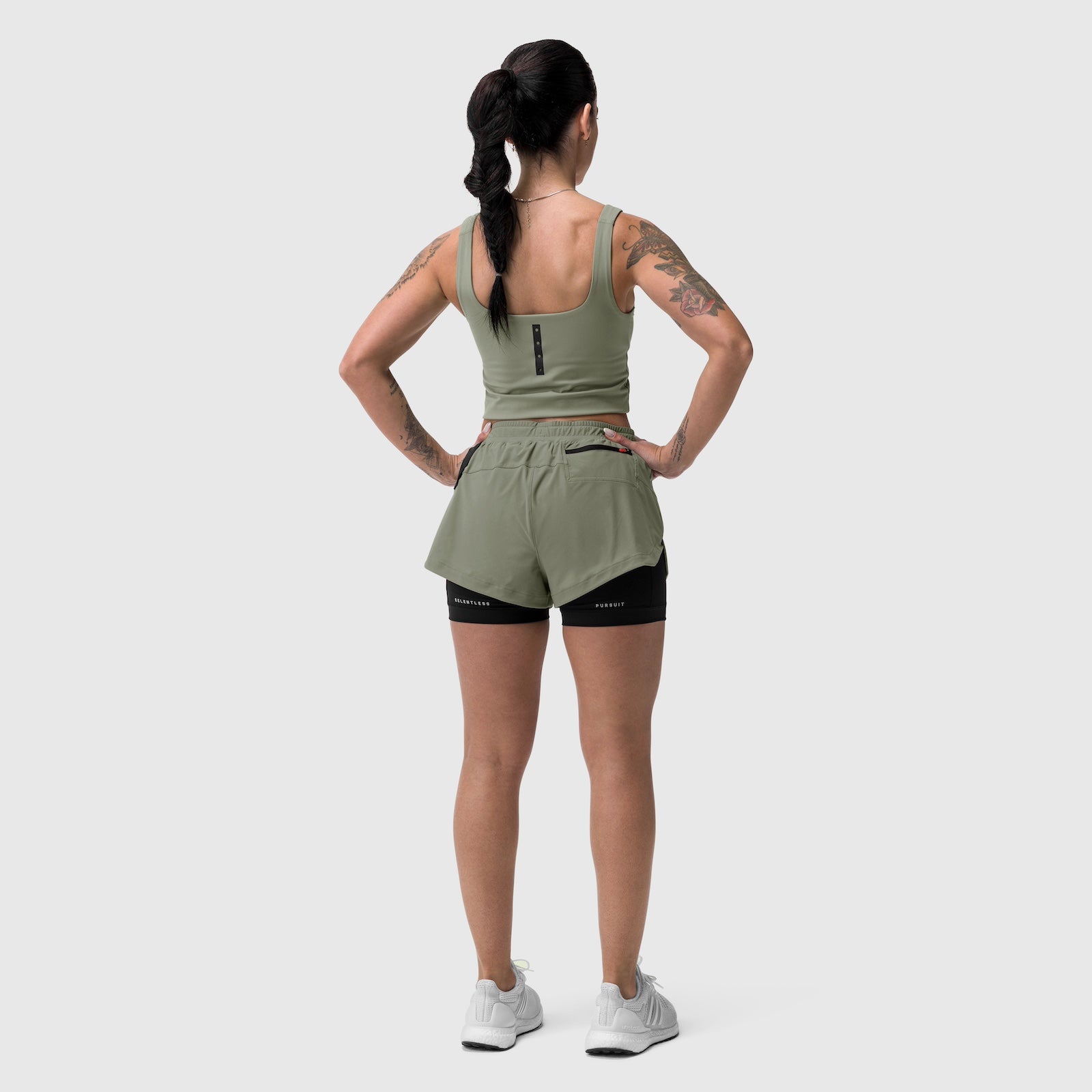 Tetra-Lite Liner Short in sage, worn by model from back, paired with matching tank top