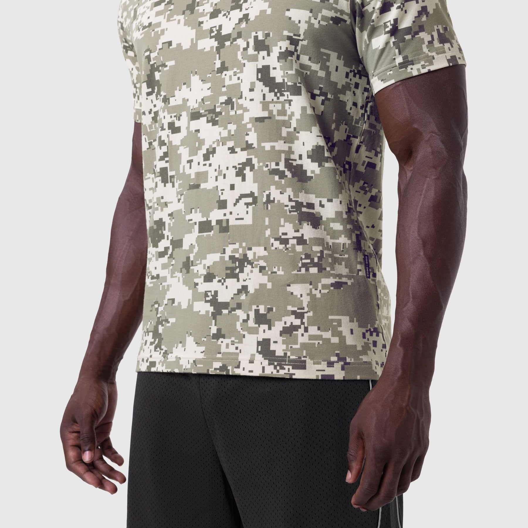 Digital camo Supima® Essential Tee worn with black shorts, side view on model