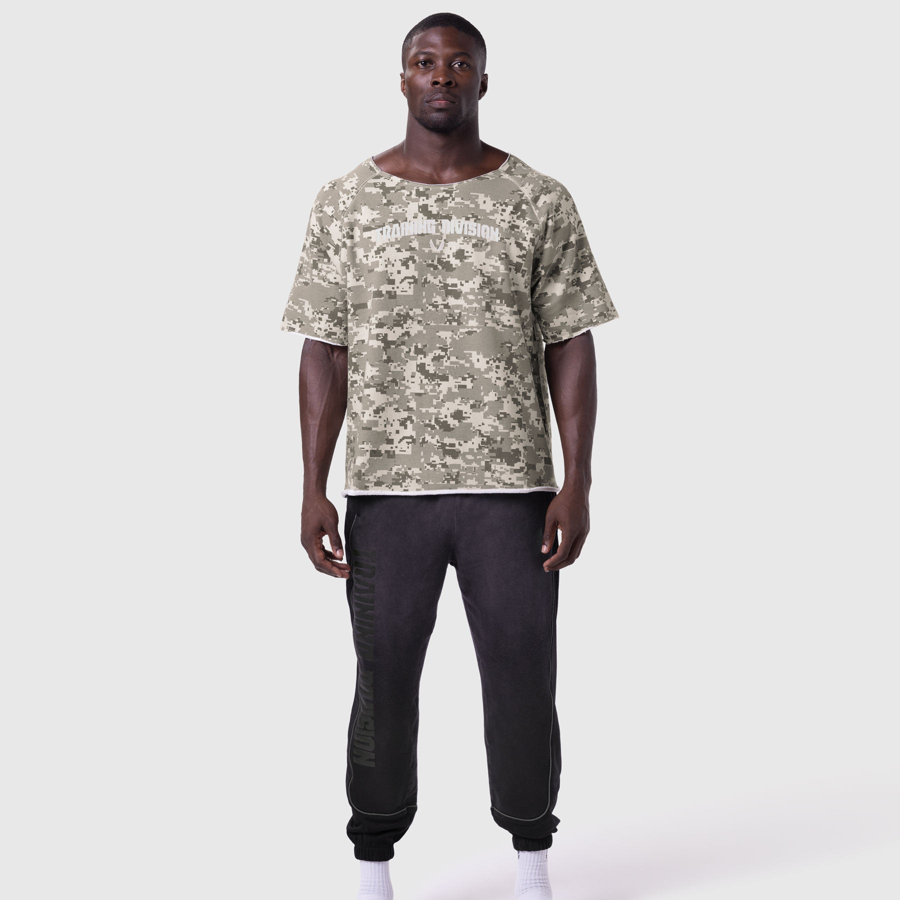 Digital camo vintage raw hem pump cover t-shirt and black joggers on model, front view