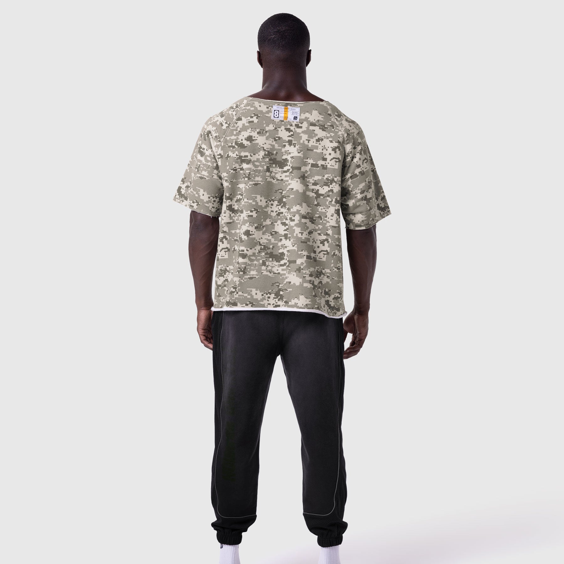 Digital camo vintage raw hem pump cover tee worn by model, back view